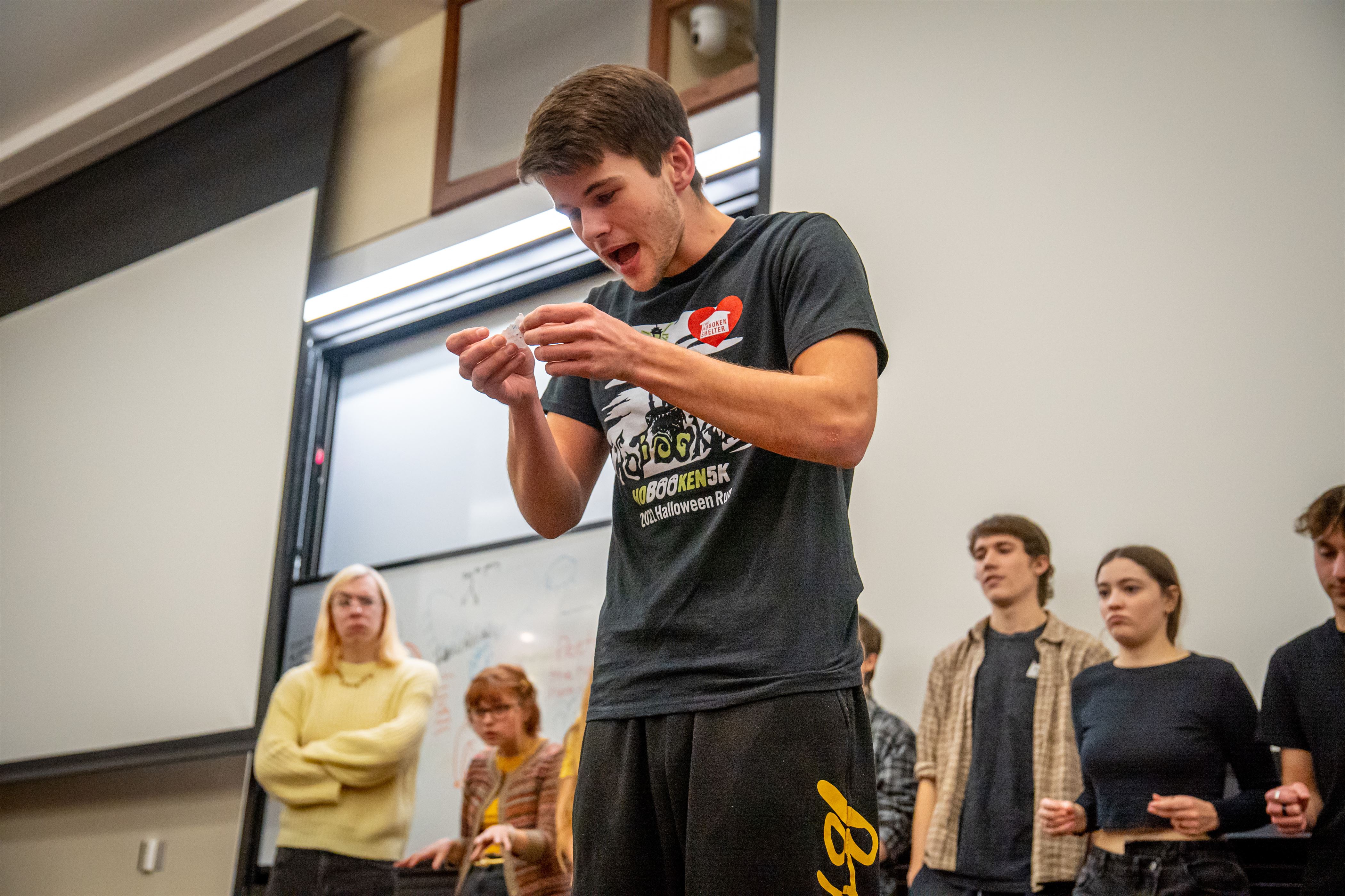 Will Barnes, a freshman sports communications major, reads the next plot out loud so other M.I.L.F's knows what to perform. Lynise Olivacce | The Montclarion