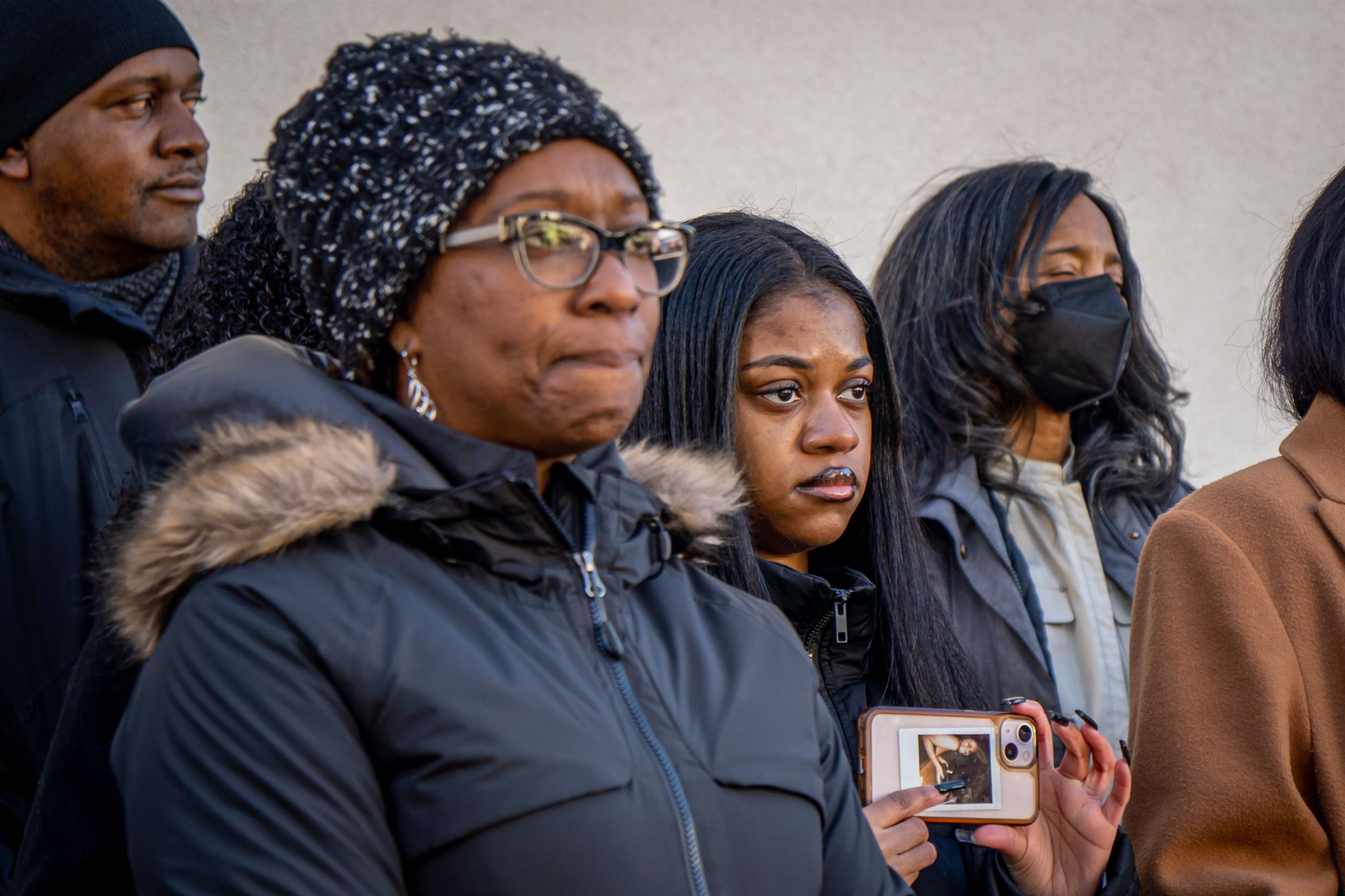 An unidentified woman and others listen to what to the speakers at the Student Center Flag Pole. The university police department leads the procession on campus. Lynise Olivacce | The Montclarion
