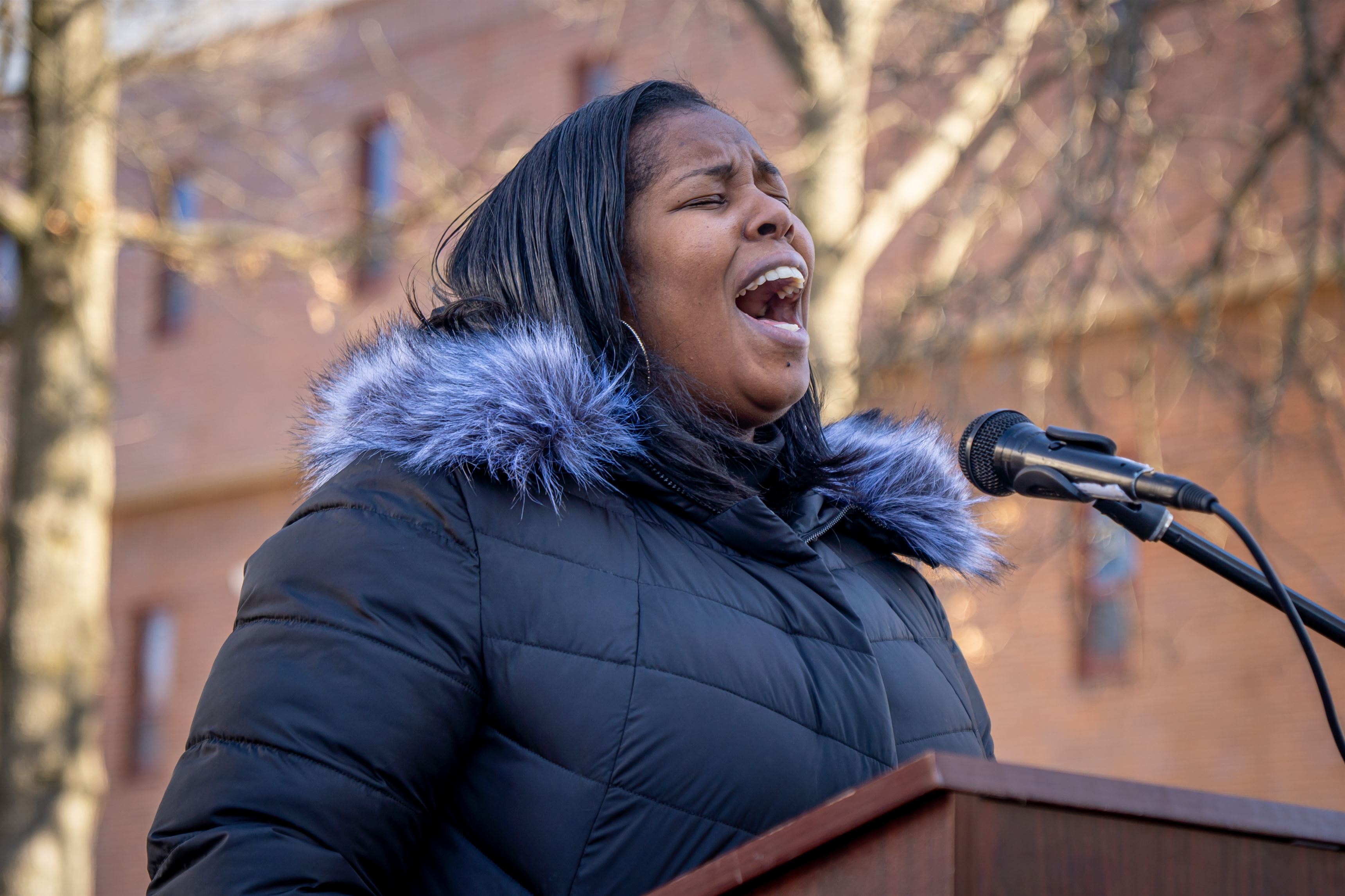 Jada Lambert sings "Lift Every Voice and Sing" at the Student Center flagpoles. Lynise Olivacce | The Montclarion