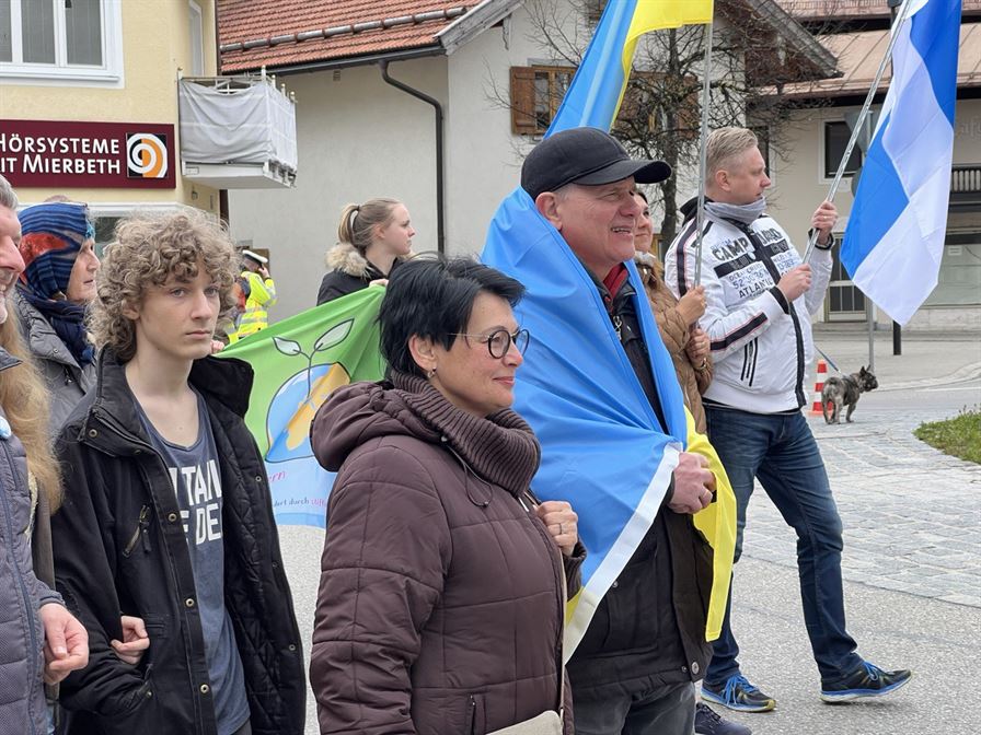 Pavlo Lushyn, wrapped in an Ukrainian flag, attends an event in Germany. Photo courtesy of Pavlo Lushyn