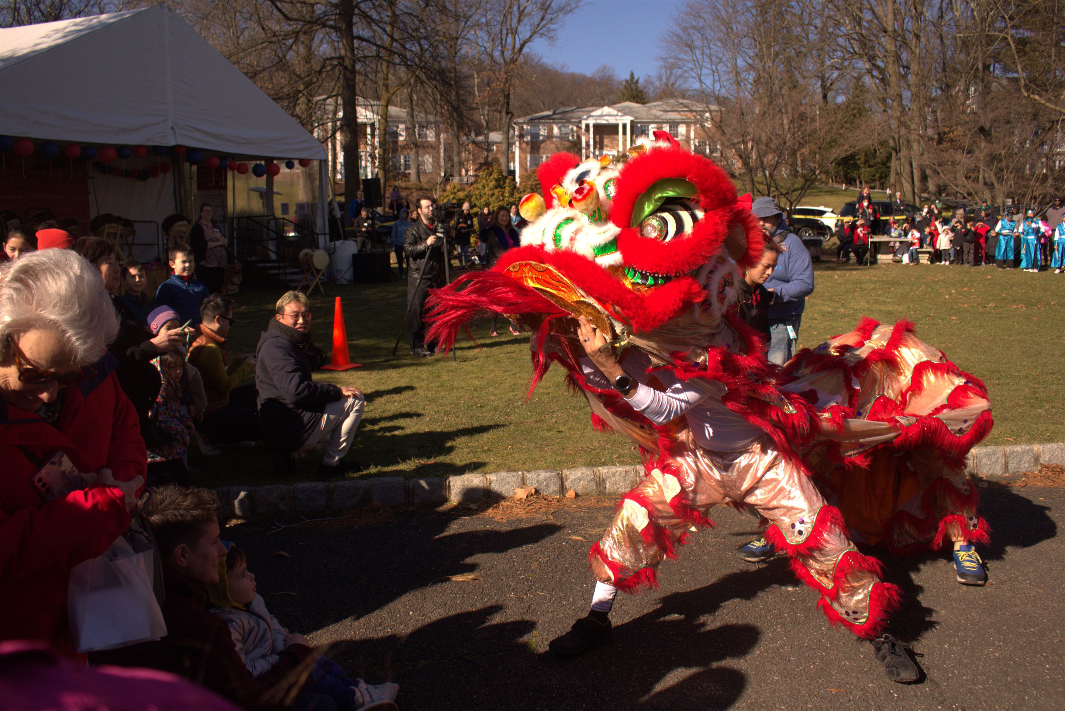 Onlookers watch as performers take part in the lion dance.
Sal DiMaggio | The Montclarion