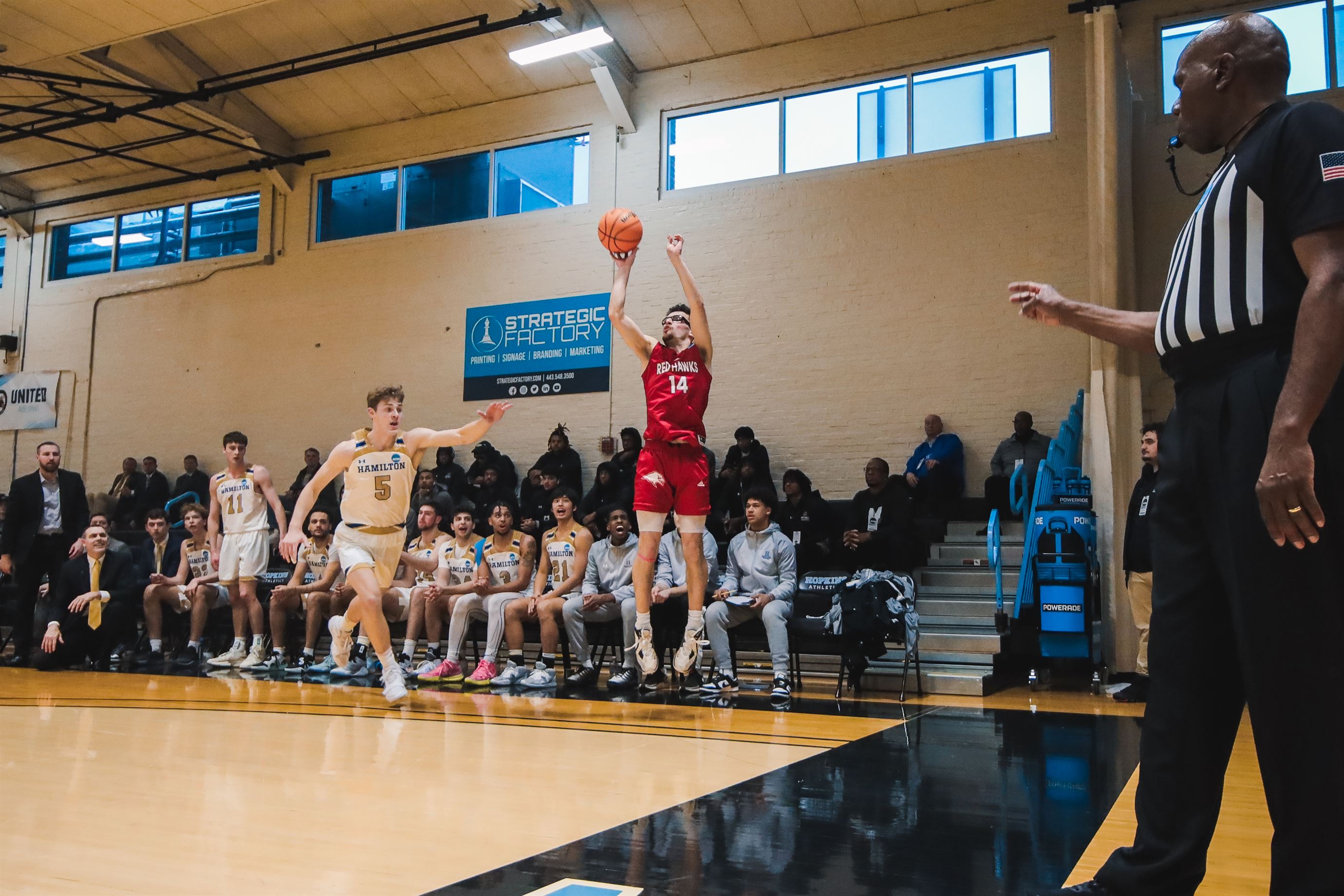 Greg Eck goes up for a corner three-pointer with a defender trailing in front of him. Photo courtesy of Markell Robinson.