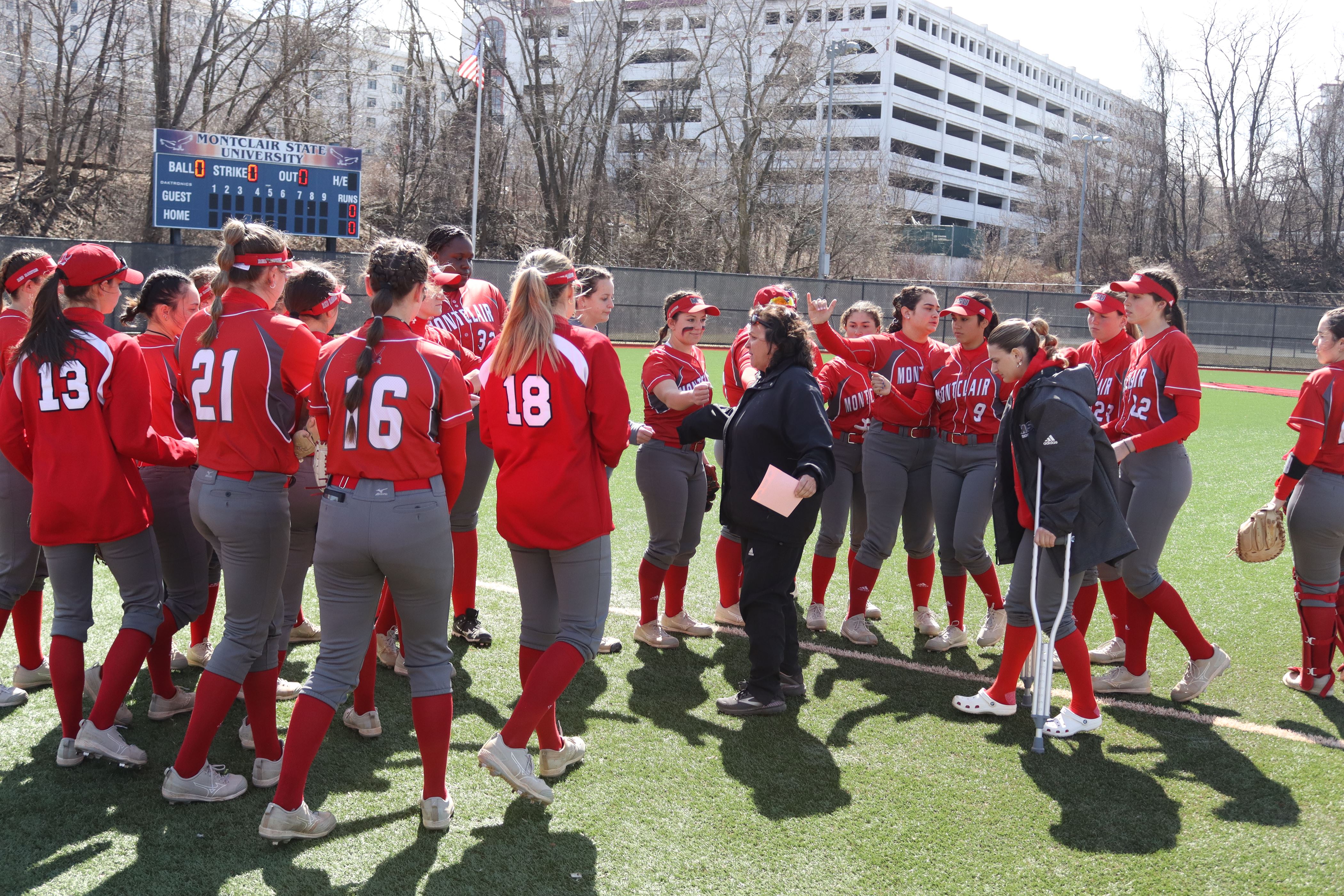 Head coach Anita Kubicka talks to the entire squad before the game. Trevor Giesberg | The Montclarion