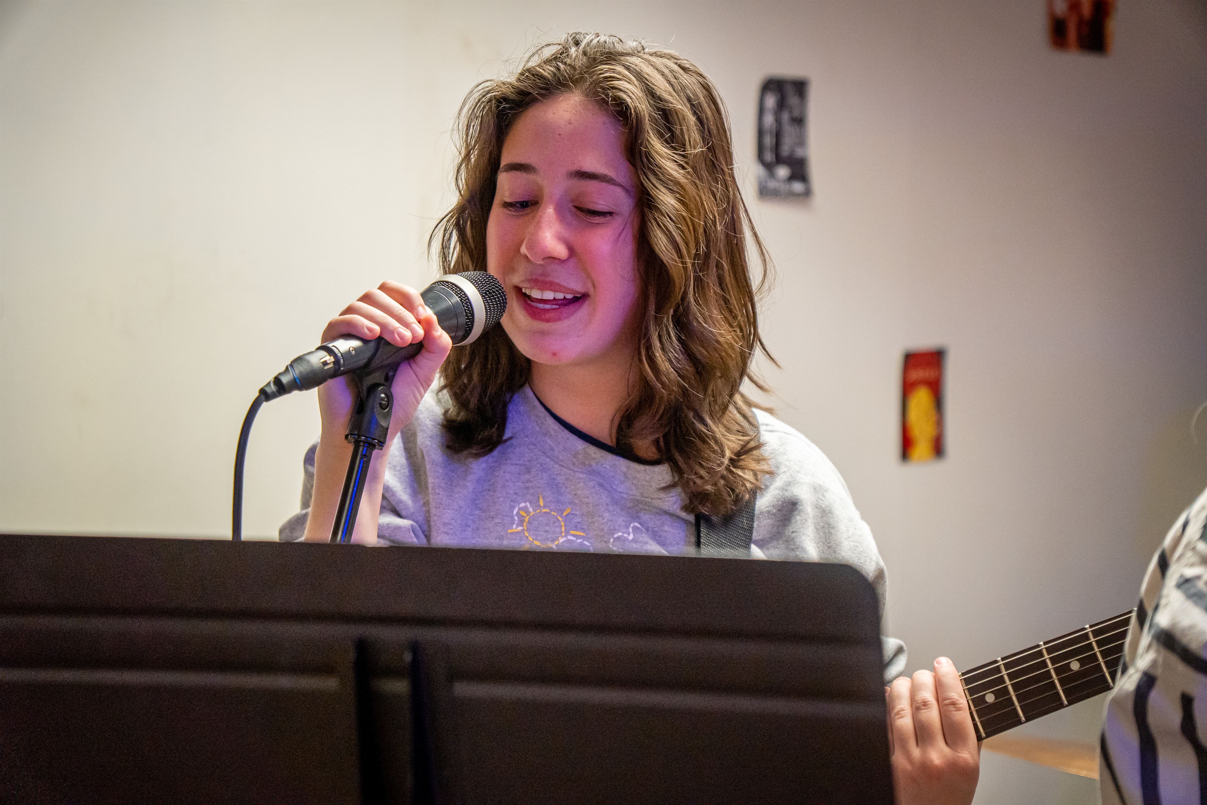 Alexa Tabbacchino, a junior recording arts and production major sings while playing her guitar. 
Lynise Olivacce | The Montclarion