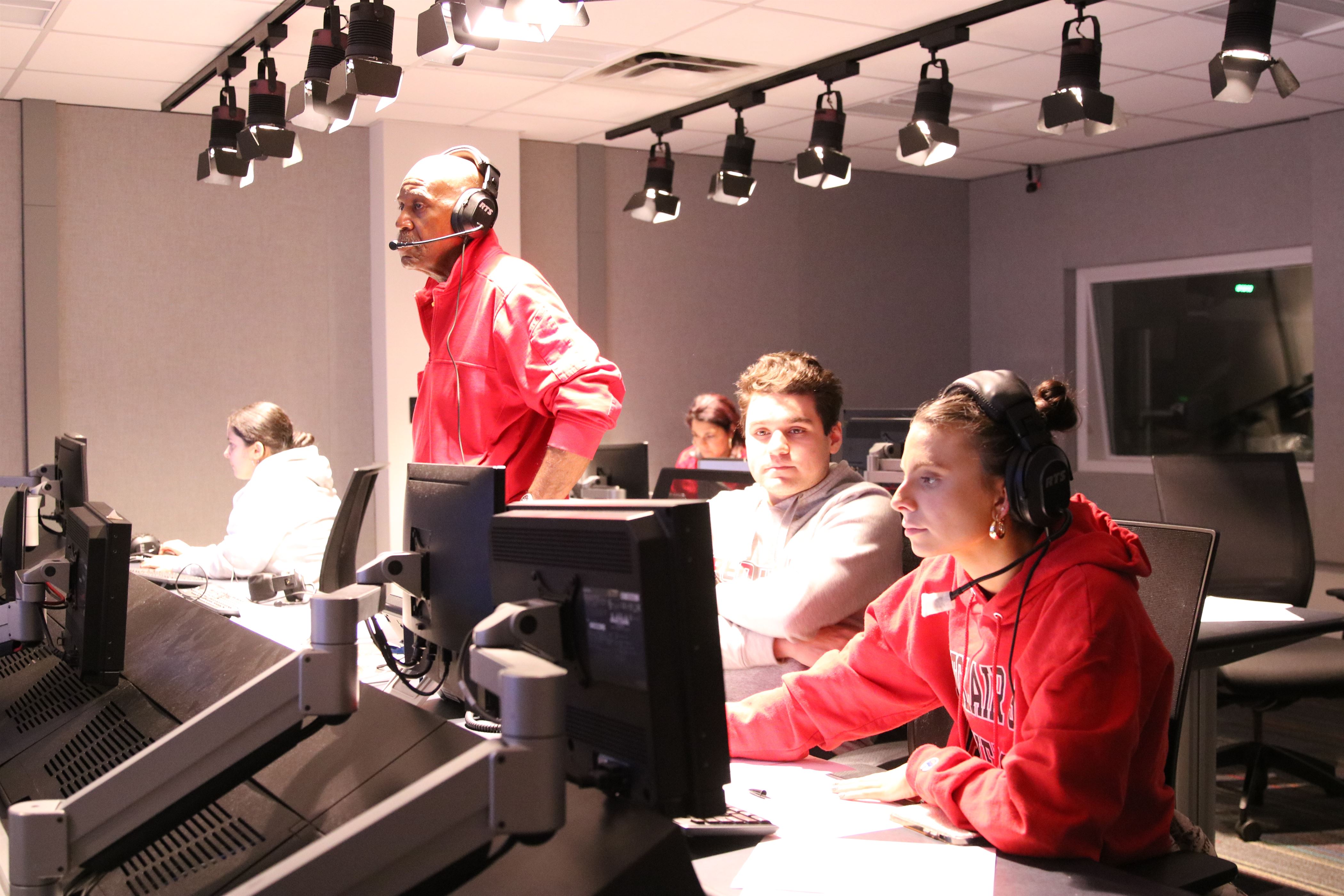 The control room, led by Professor Vernard Gantt, watches as they set up for the broadcast. Photo courtesy of Maria Barbieri.