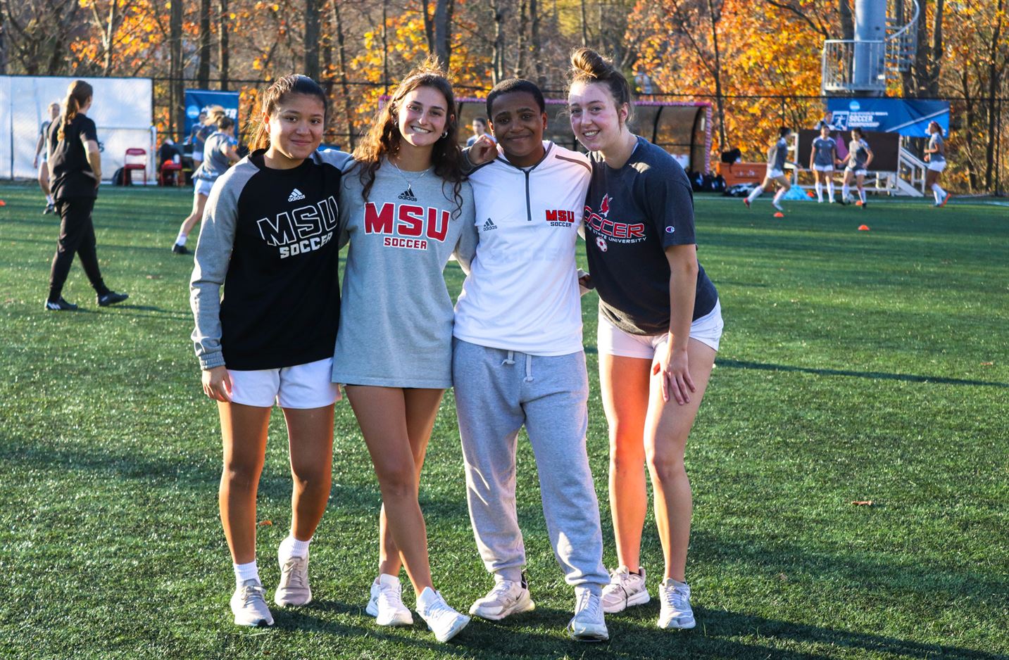 A few members of the women’s soccer team pose for a photo. Trevor Giesberg | The Montclarion