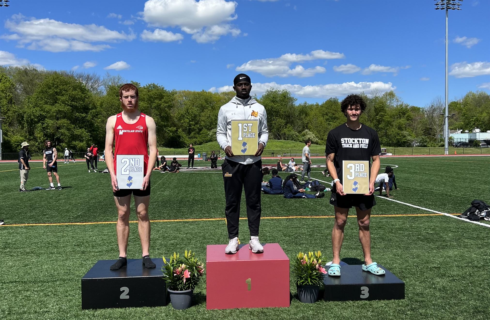 Graduate student Anthony Dimaulo on the podium for the long jump.