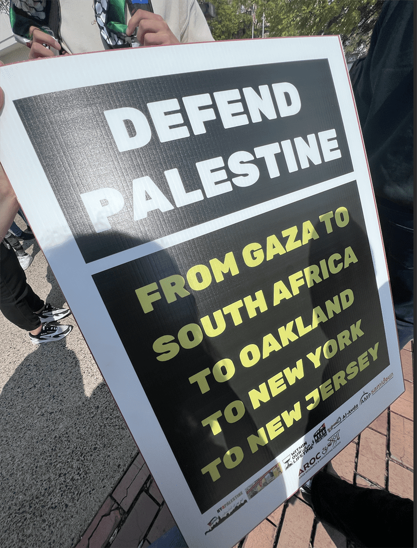 One of the signs held by Palestinian protesters