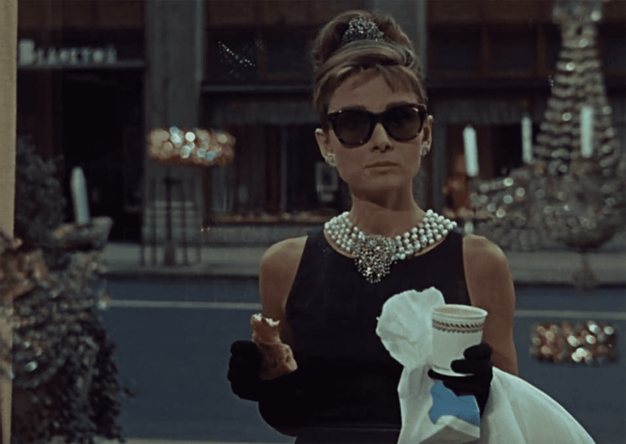 As shown by "Breakfast at Tiffany&squot;s," cat eye sunnies, a long monochrome black dress and a stack of pearls is all one ever needs to establish great style. Photo courtesy of Paramount Pictures