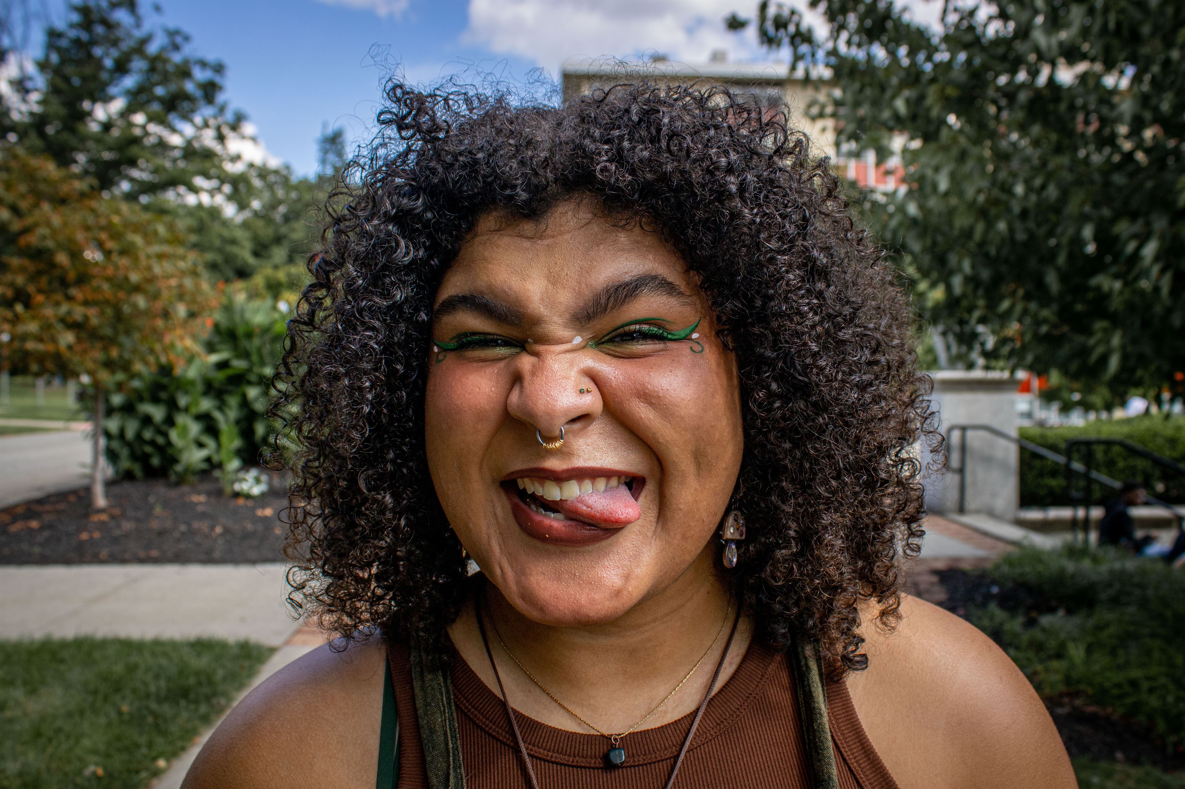 Arianna Joseph, sophomore music education major, matches her green and floral overalls to her eye makeup.