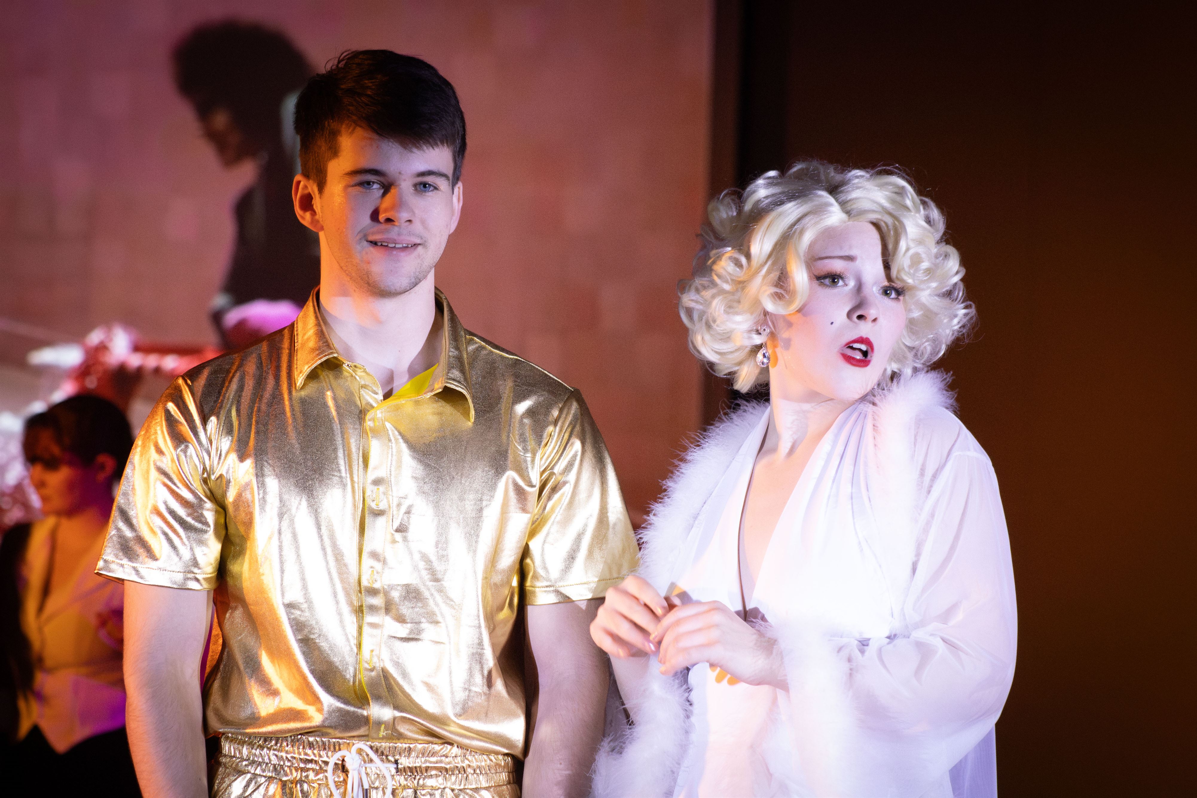 Frank-N-Furter, played by Rylee Rose, performing the "Charles Atlas song" while admiring Rocky, played by Will Barnes. Dani Mazariegos | The Montclarion
