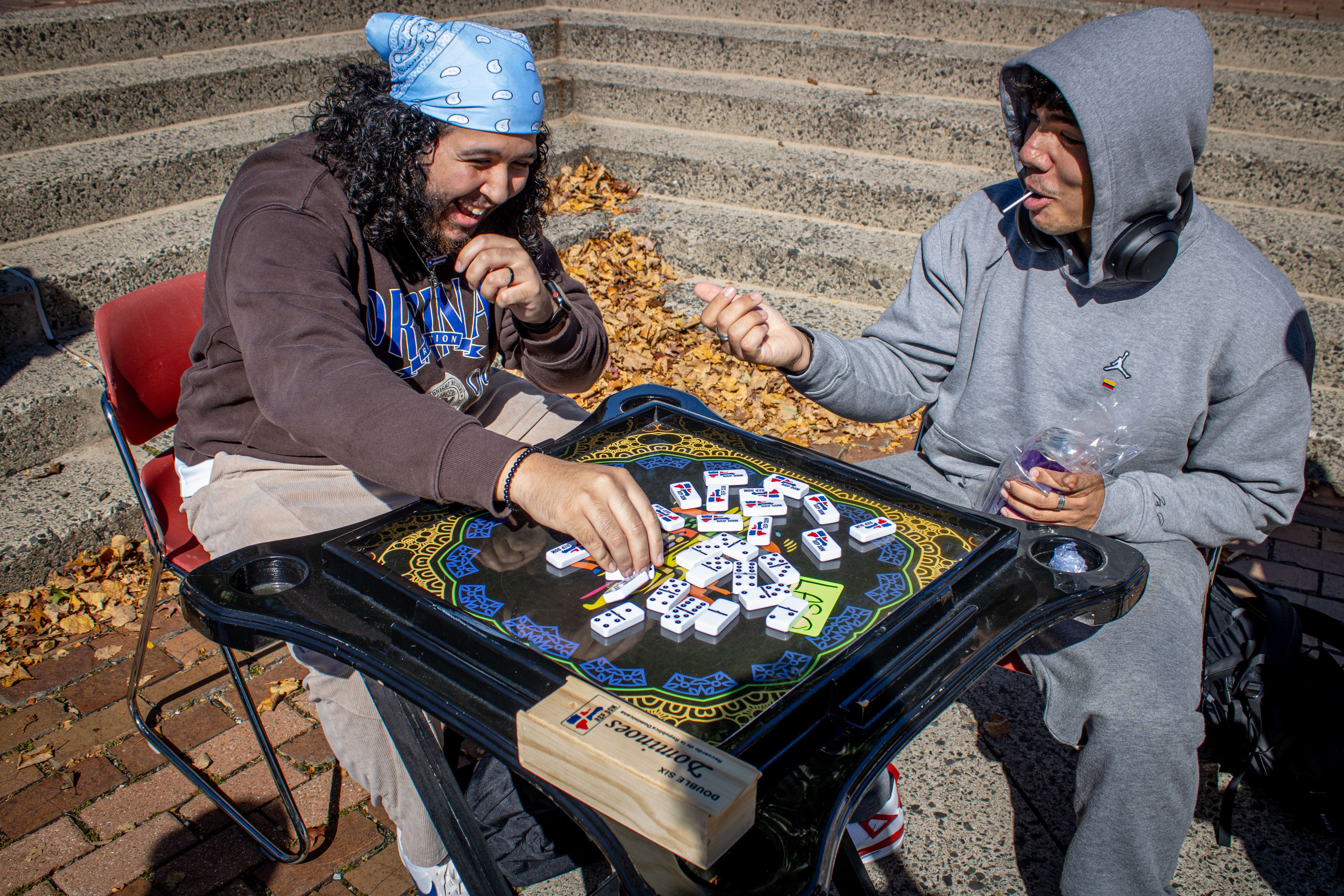 Students playing dominoes. Dani Mazariegos | The Montclarion