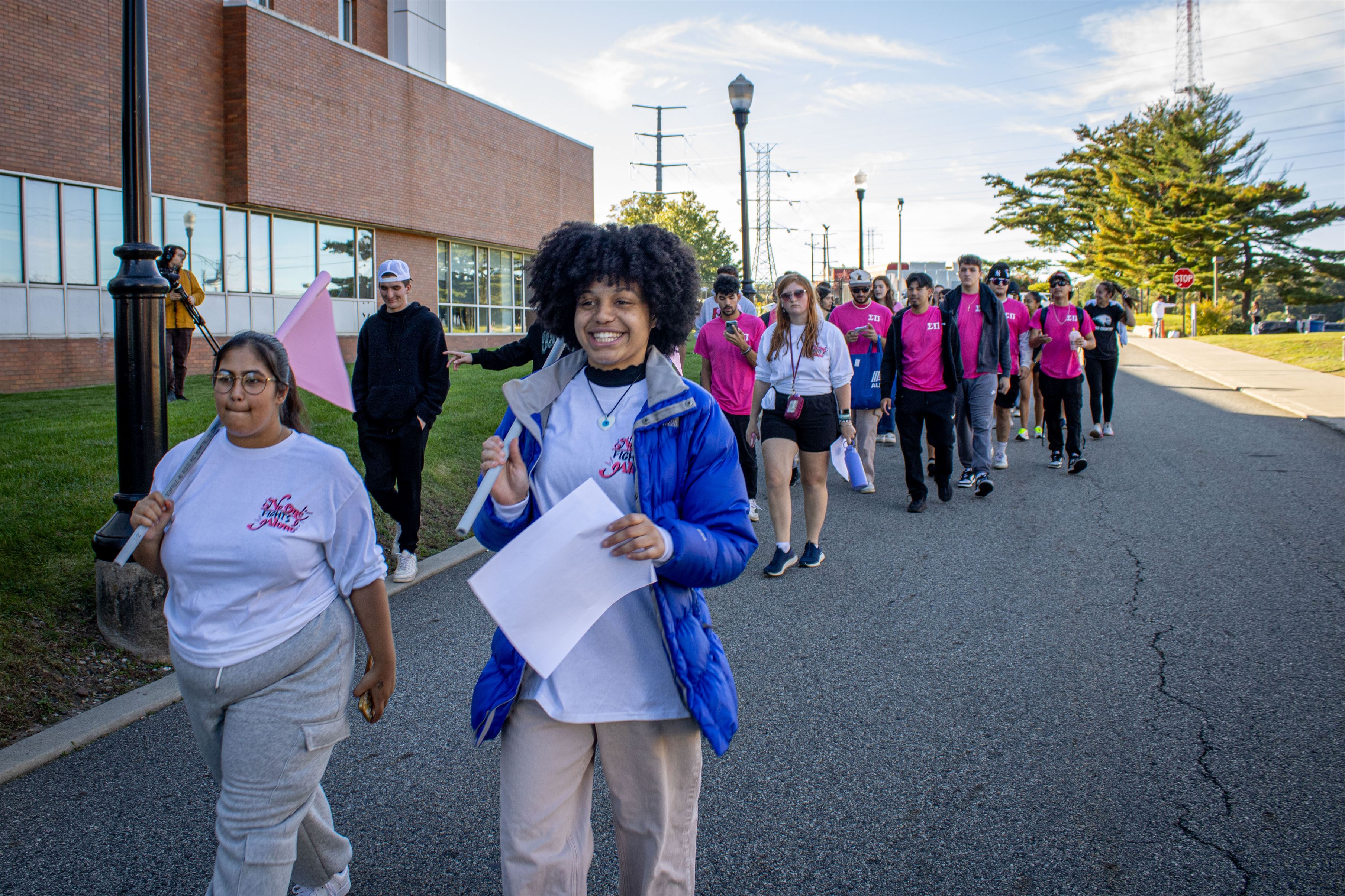 Students walking around campus as part of a Cancer Awareness event.  Photo courtesy of Dani Mazariegos | The Montclarion