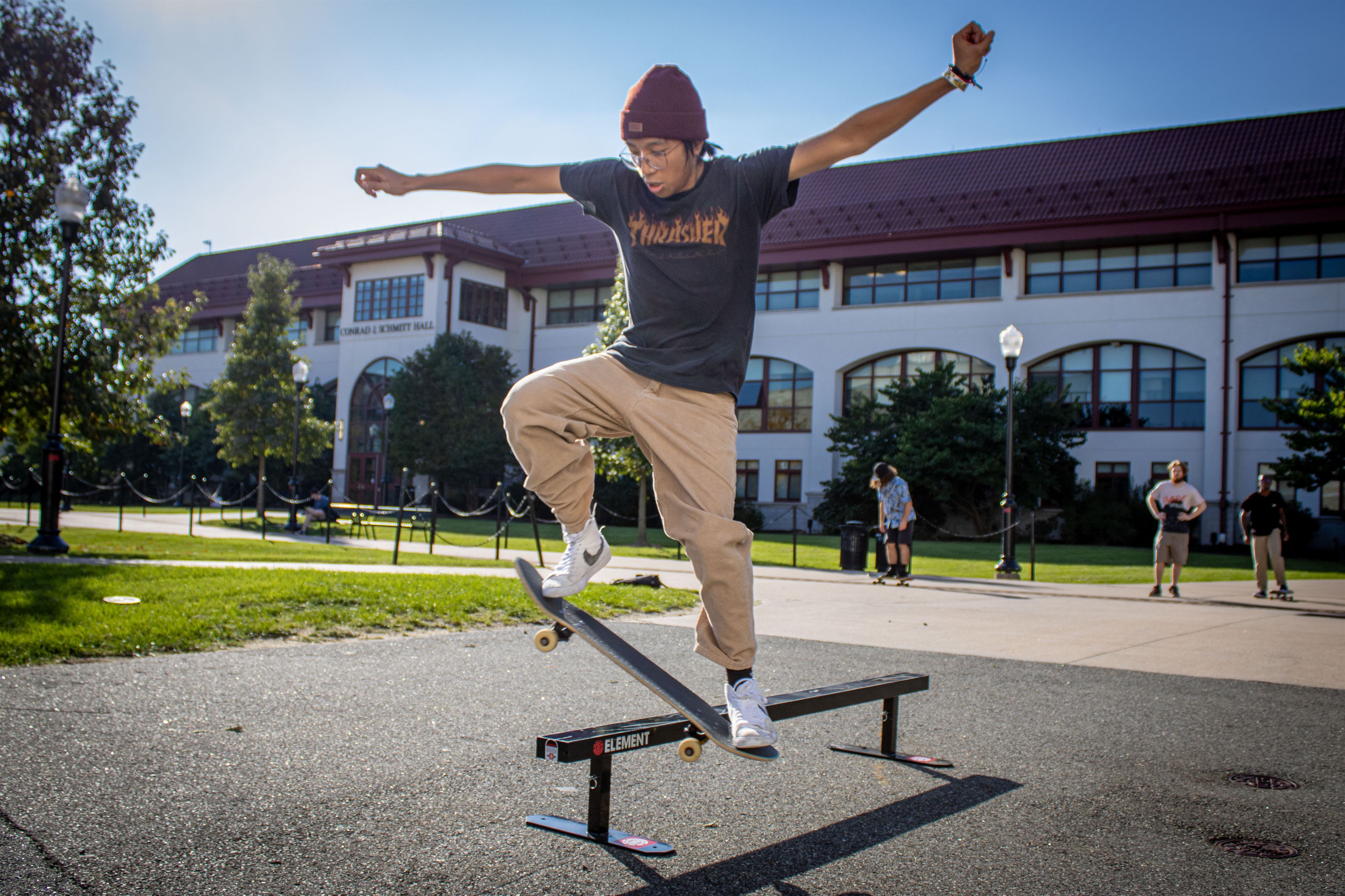 A skateboarder attempting a trick on the rail. 
Dani Mazariegos | The Montclarion