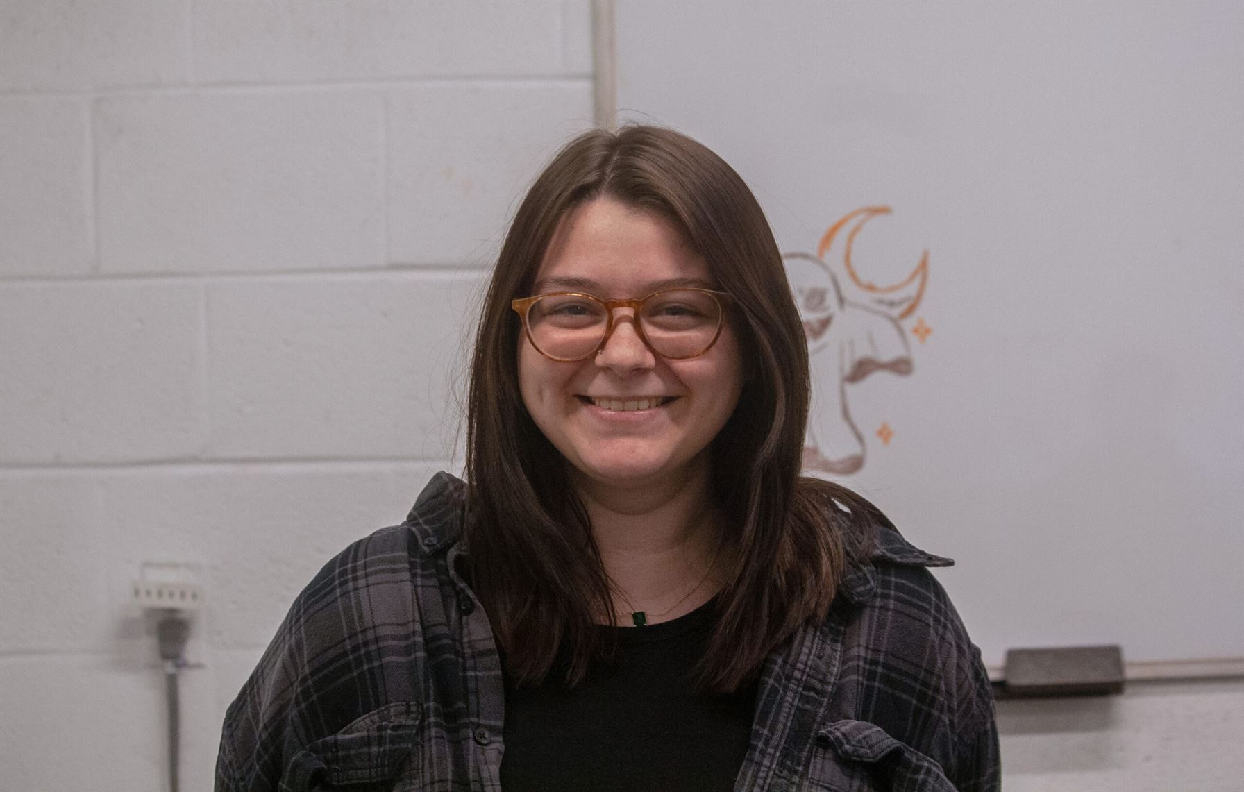 Nina Andrews, treasurer of the photography club, smiles for the camera. Photo courtesy of Angel Santos