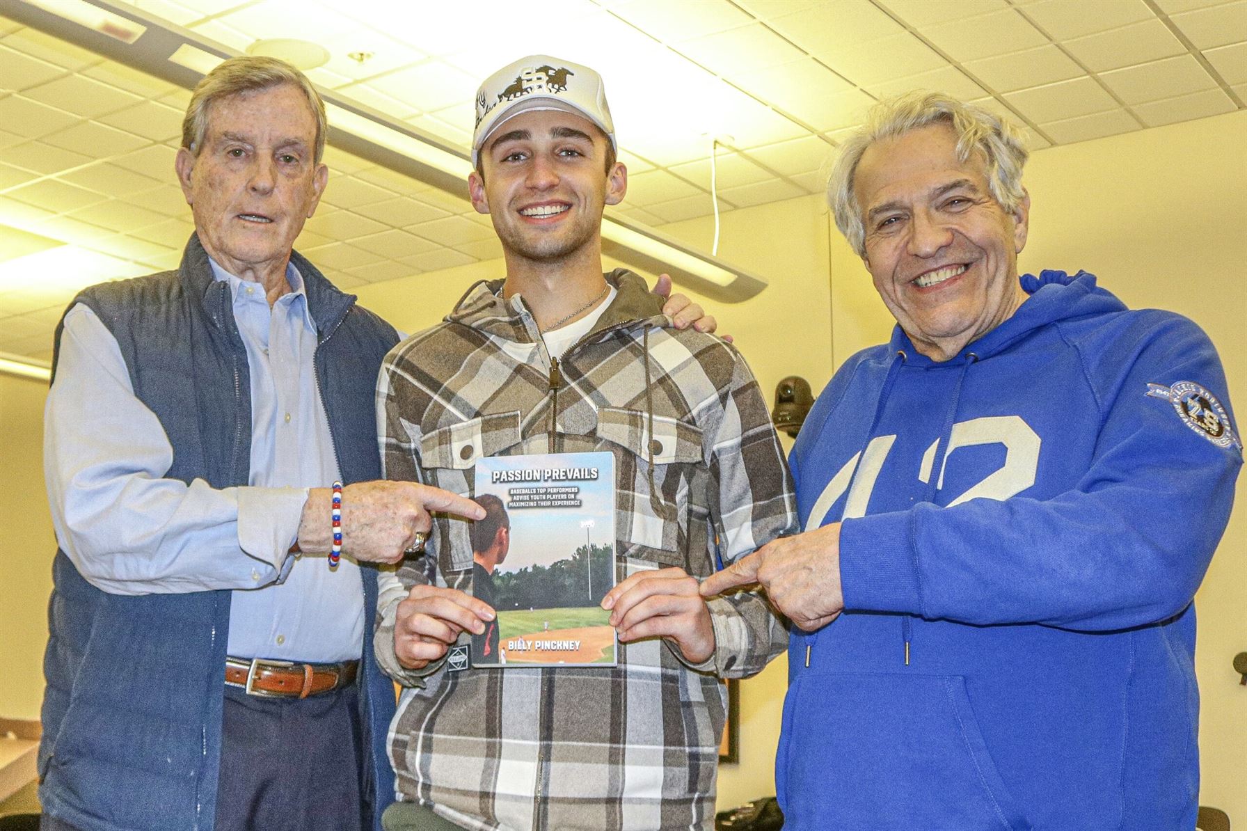 Author Billy Pinckney (middle) holding his book with Montclair professors, Professor McCarthy (left) and Dr. Gilbert (right).  Photo courtesy of Billy Pinckney.
