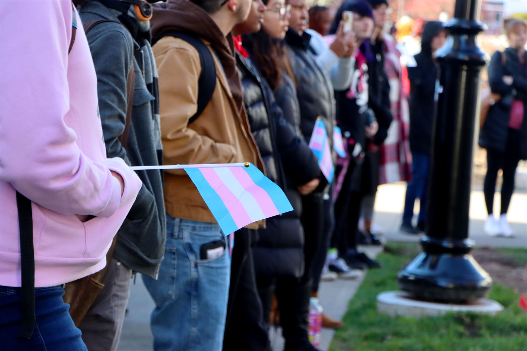 Students hold transgender flags and listen to the speakers at the flag raising ceremony. Claudia Martillo | The Montclarion