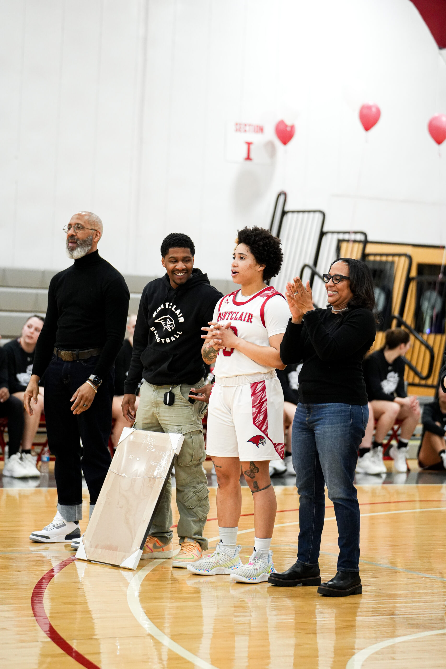 Senior guard Kendall Hodges being honored on senior night with her family. Lloyd Odimegwu | The Montclarion