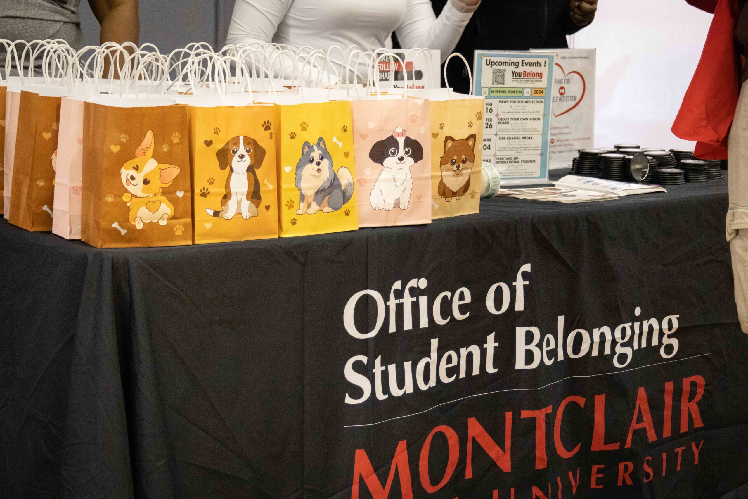 Goodie bags with various dog designs from the office of Student Belonging. Allen Macaraeg | The Montclarion