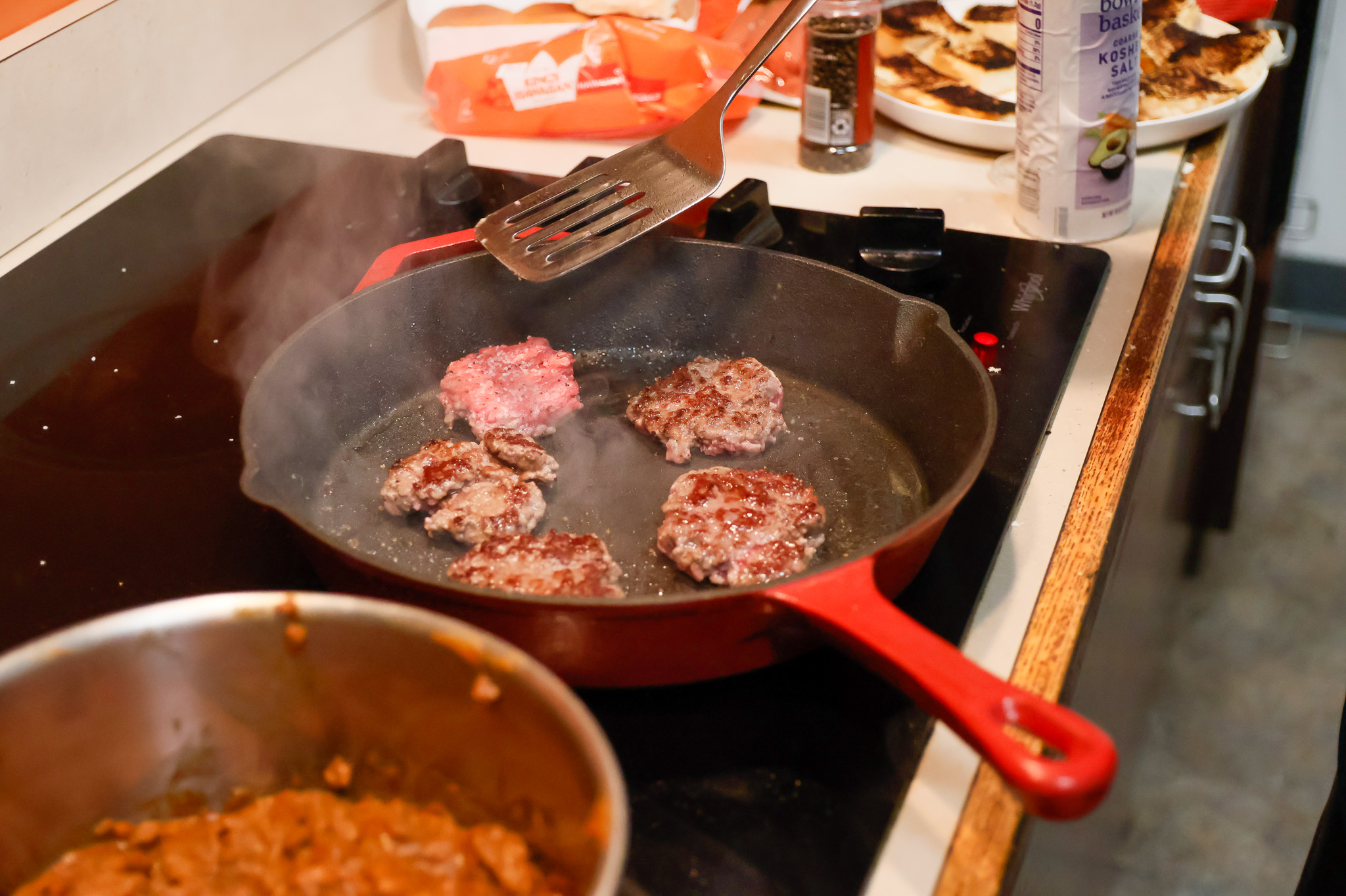 Once you have as many meat balls as you can fit on your skillet, start squishing them down into proper patties.
Sal DiMaggio | The Montclarion
