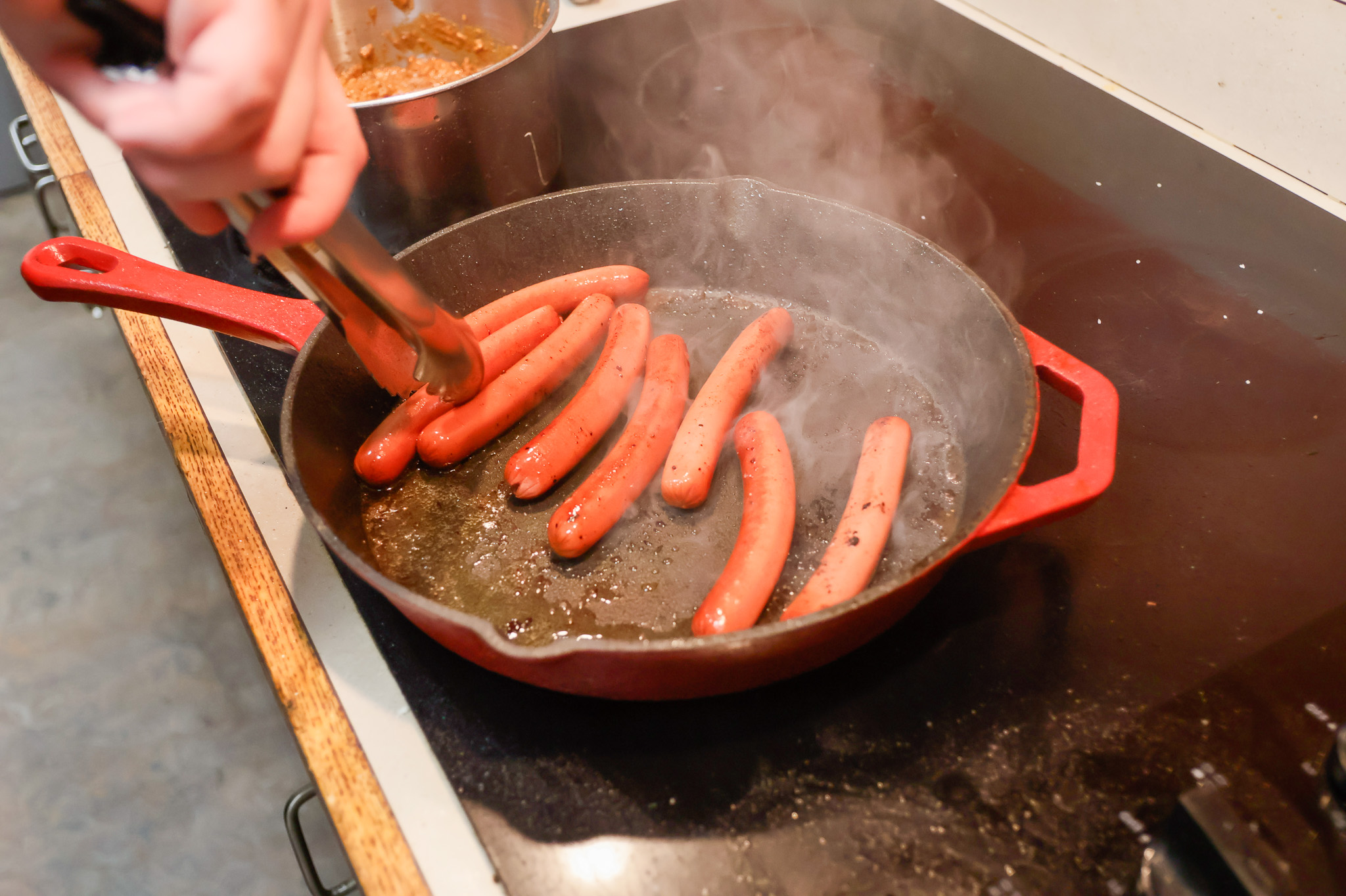 You can boil your hot dogs in a pinch, but cooking them in a pan tastes much better. 
Sal DiMaggio | The Montclarion
