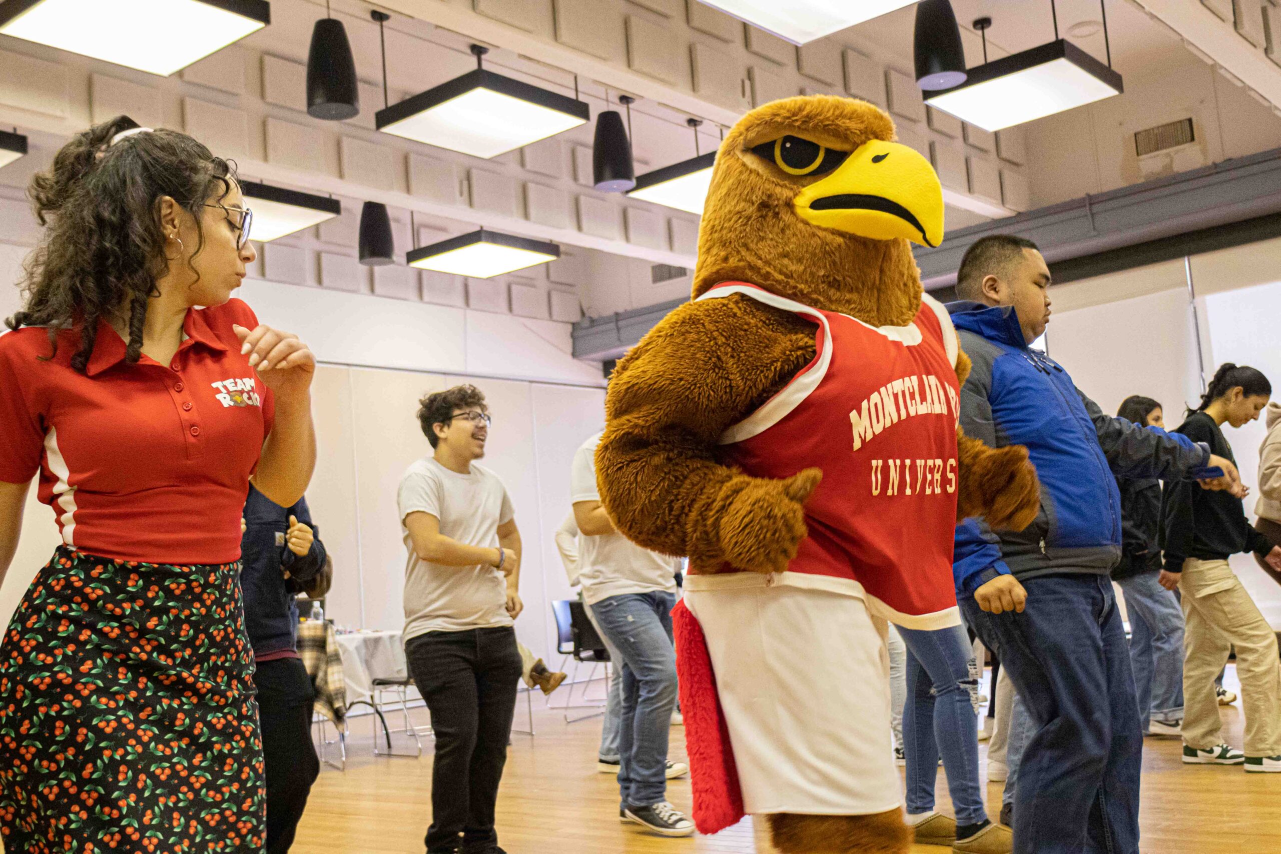 Rocky the Red Hawk leads a group dance. Allen Macaraeg | The Montclarion
