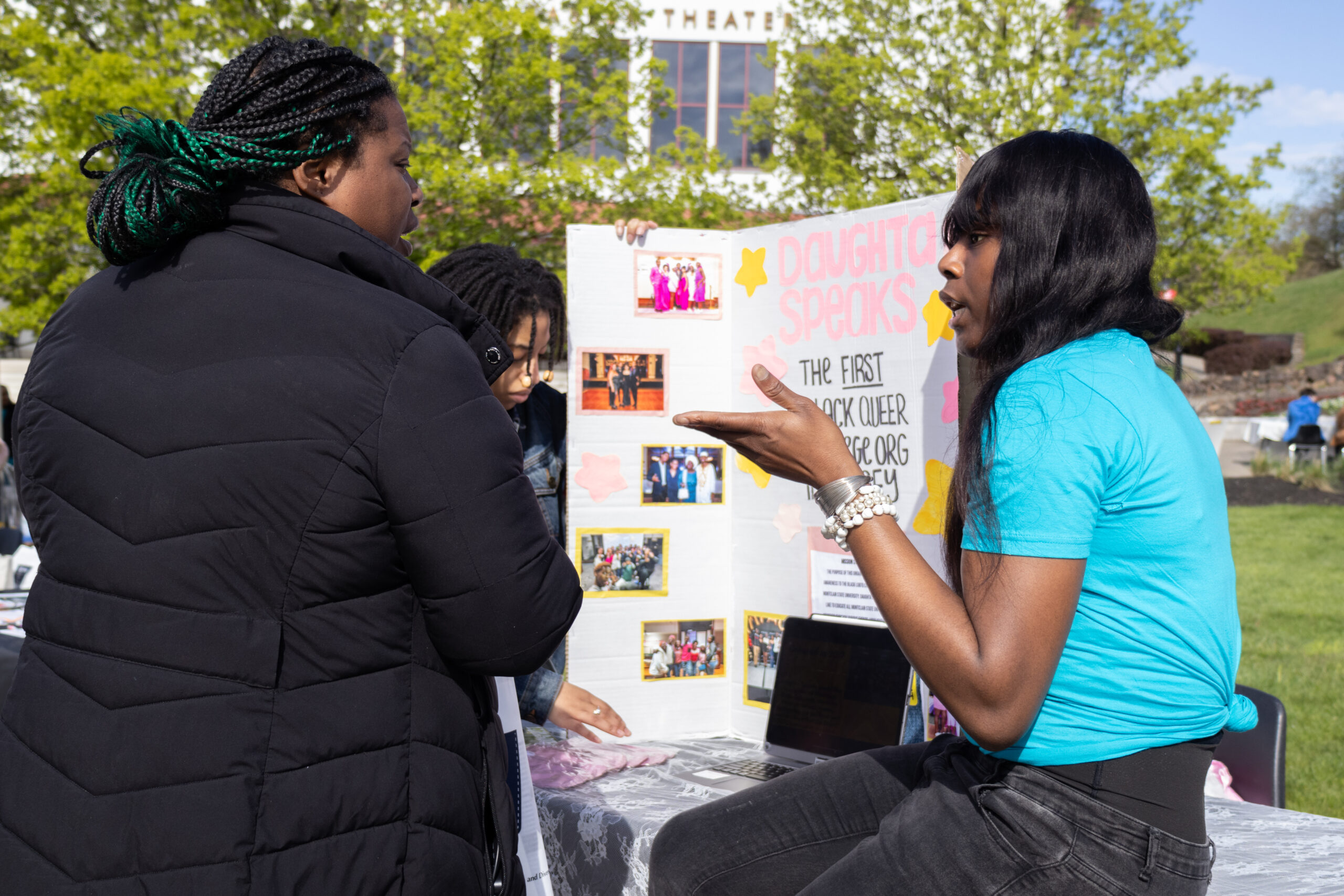 Person speaking to a representative of Daughta Speaks, the first black queer college student  organization in New Jersey. Allen Macaraeg | The Montclarion