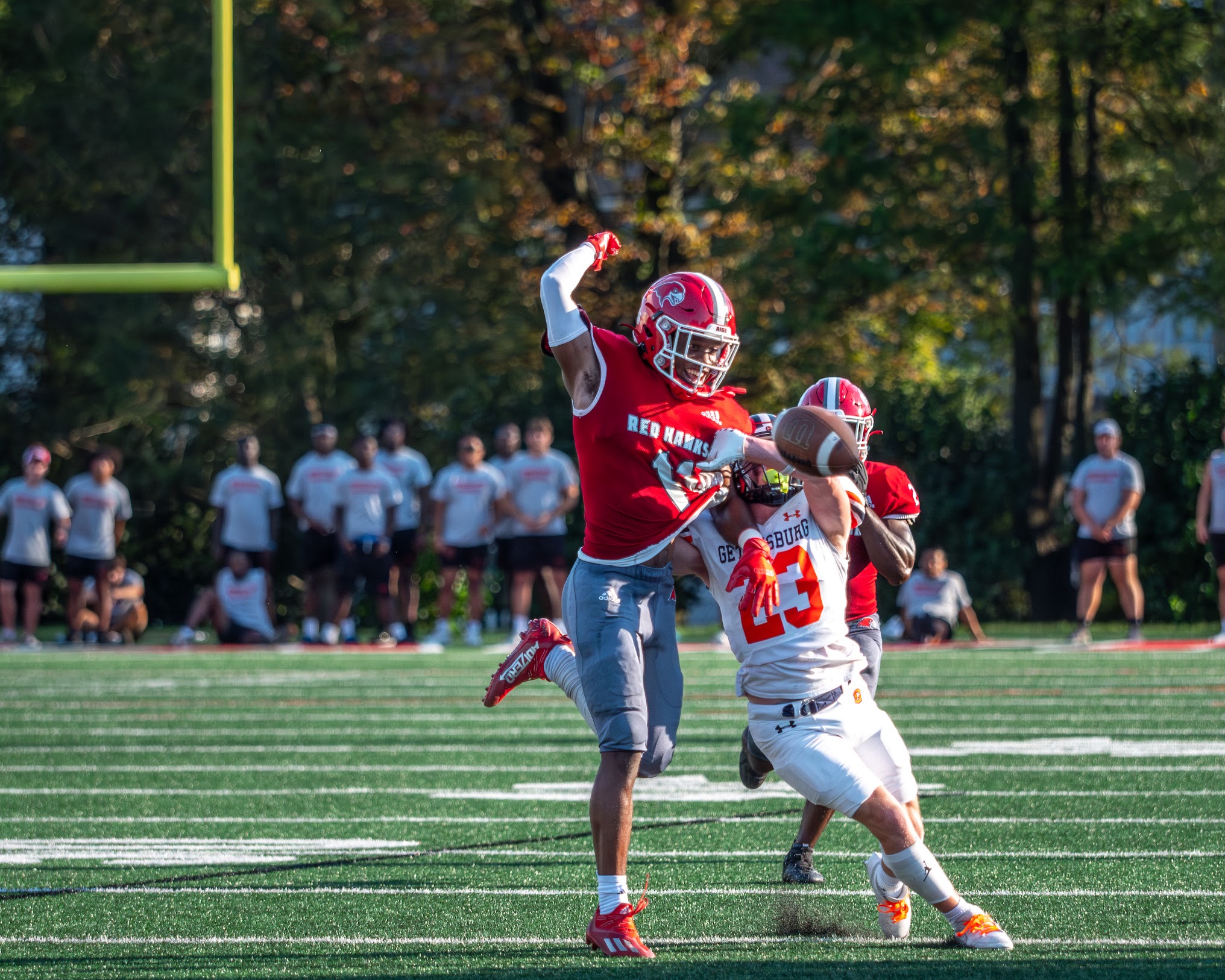 Senior defensive back Brandon Primus swats a ball away from his opponent.