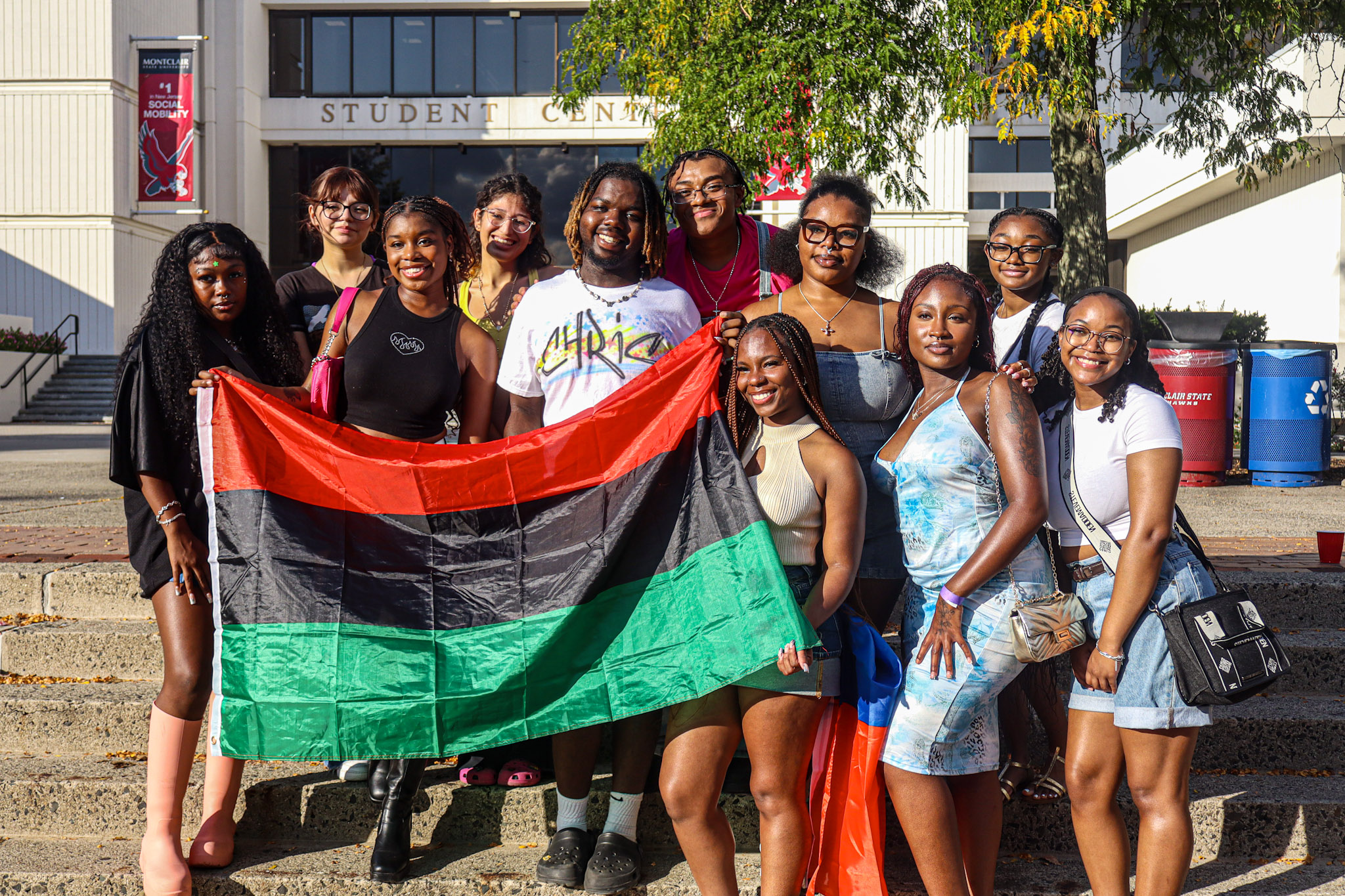 Black Student Union E-Board posing together with the Pan-Africanism flag. David Bien-Aime┃The Montclarion