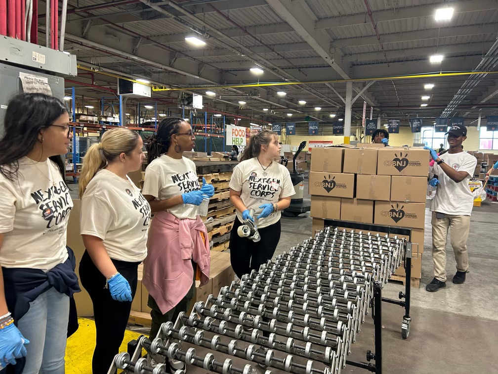 Student volunteers working together to load boxes. Grace Velazquez | The Montclarion