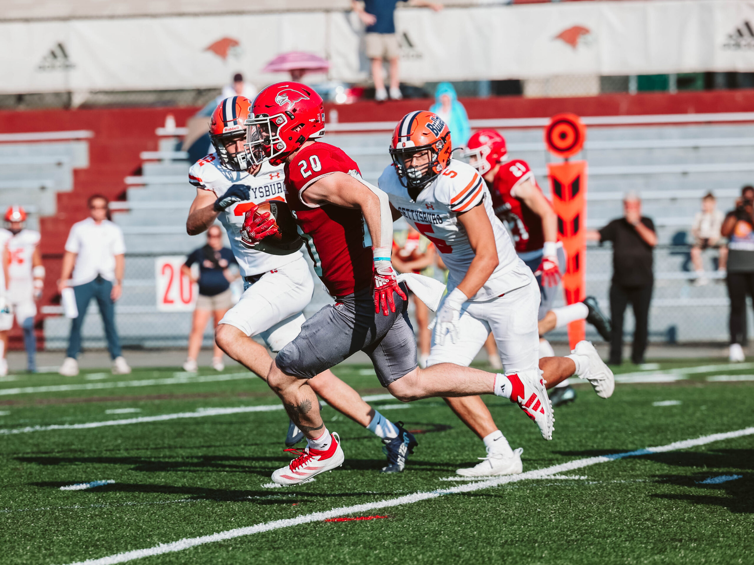 Junior running back Henry Lewis carries the ball against Gettysburg College.