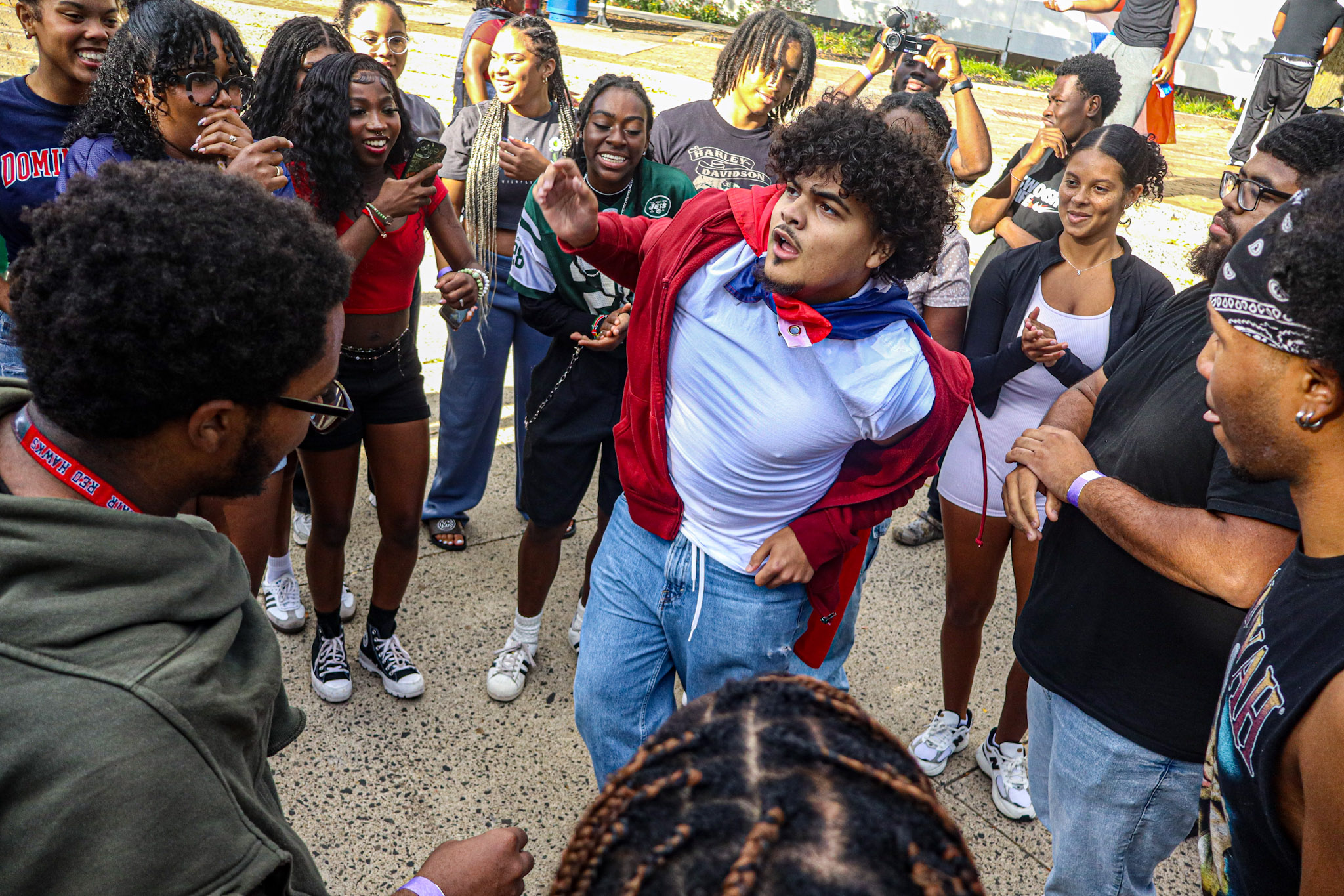 Students circle around dancer at the party. David Bien-Aime┃The Montclarion