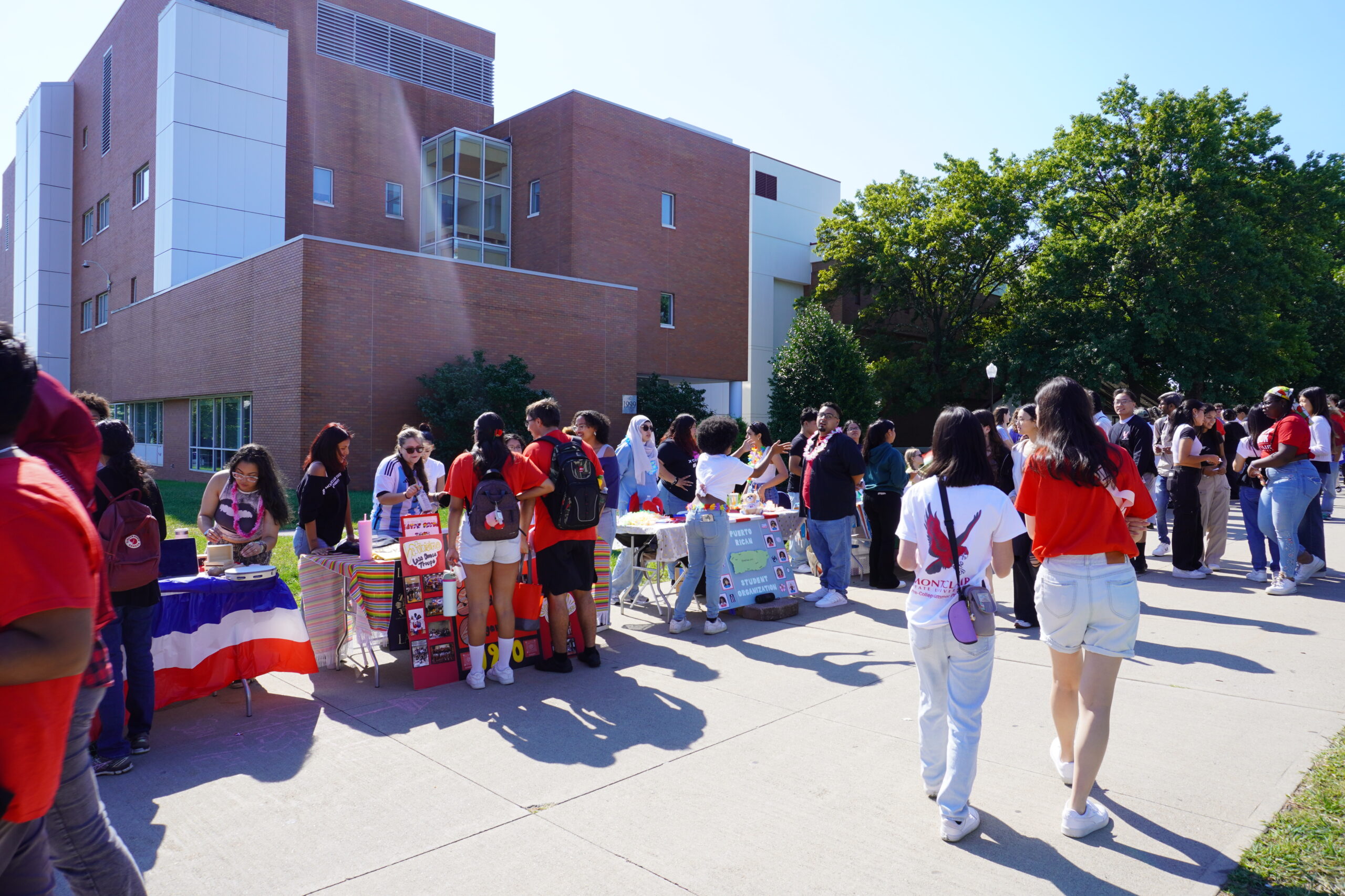 Students walk through the involvement fair, talking to club members about the organizations on campus. Jordan Reed | The Montclarion