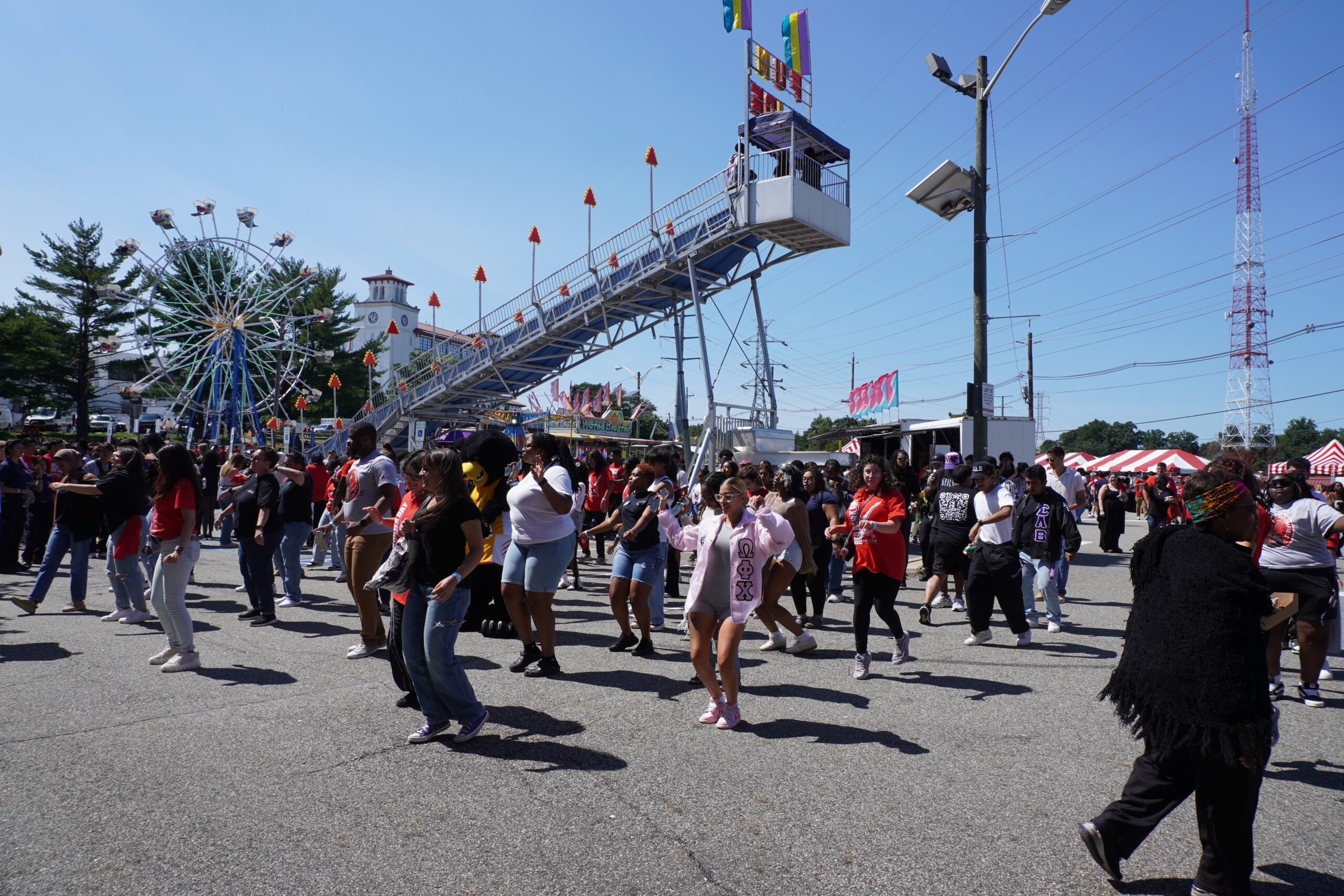 Students perform a synchronized dance at the Red Hawk Day Carnival. Jordan Reed | The Montclarion