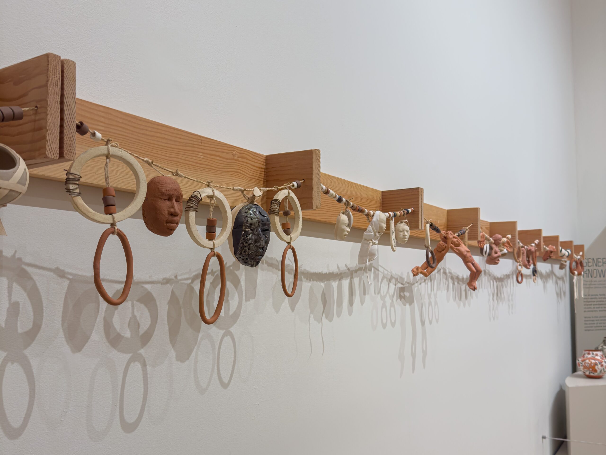 Timeline necklace, Roxanne Swentzell and Rose B. Simpson, a Santa Clara Pueblo mother daughter duo, constructed from ceramic, mud beads, and other materials