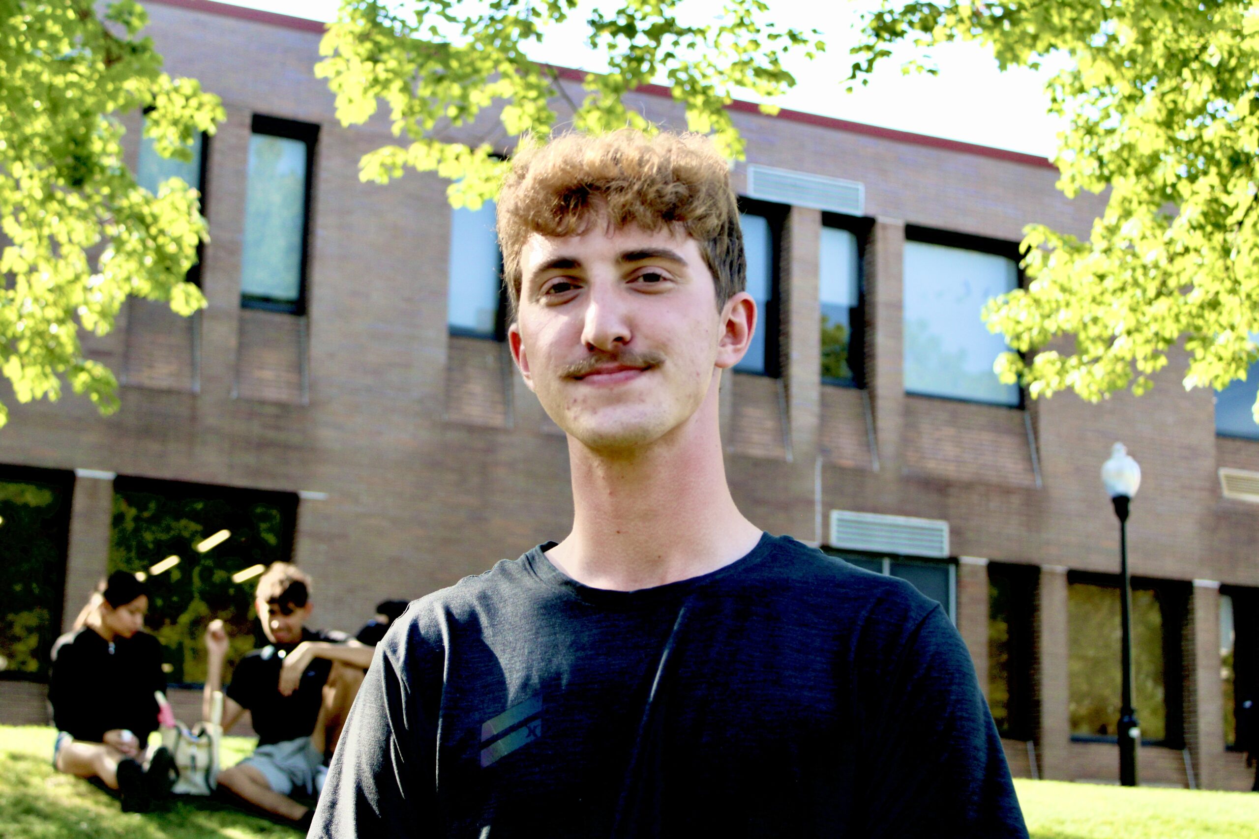 Lucius Patti smirks on the Student Center Quad