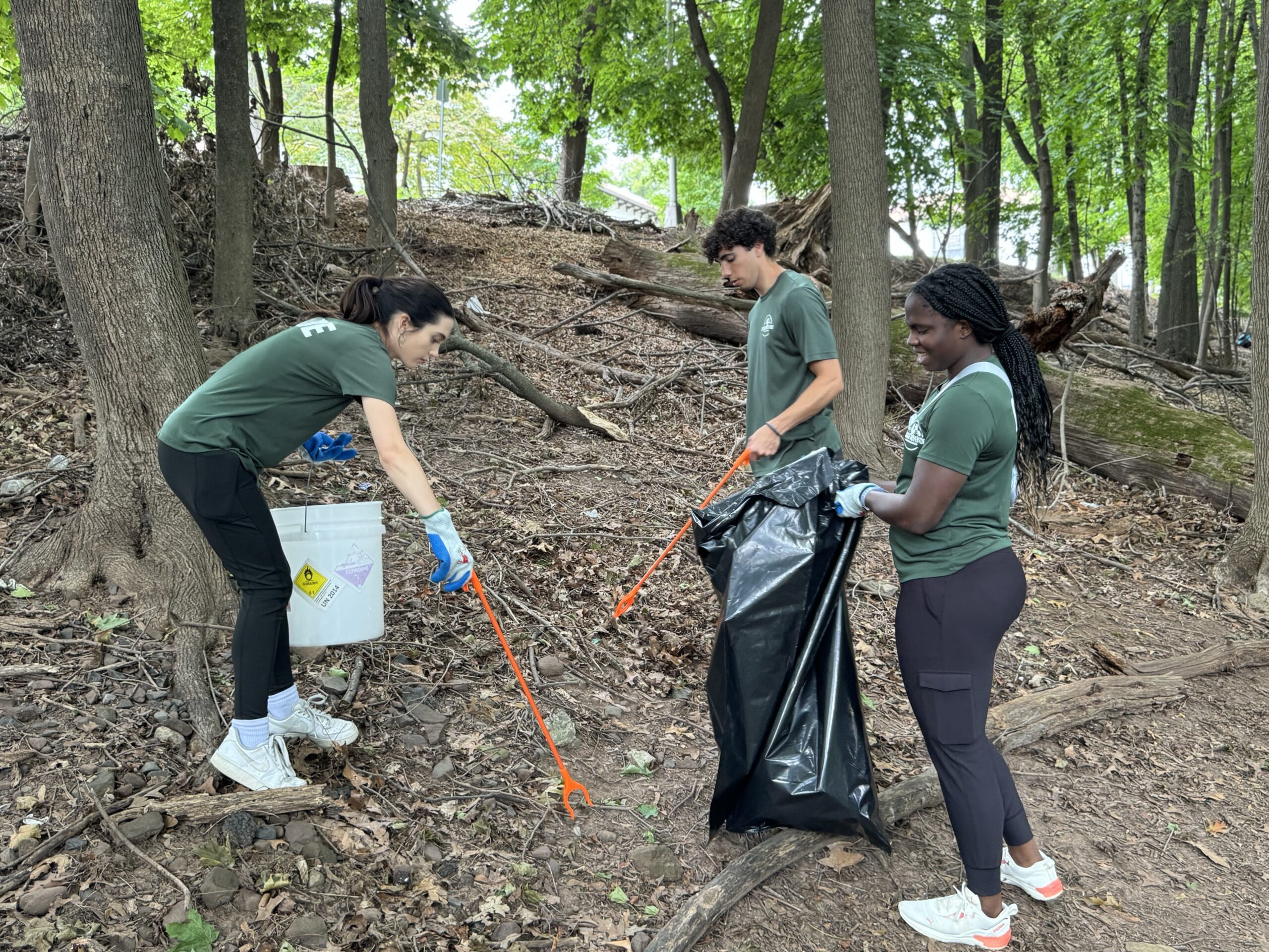 Students gathering leaves and sticks to clear the path. Dominick Cicero | The Montclarion