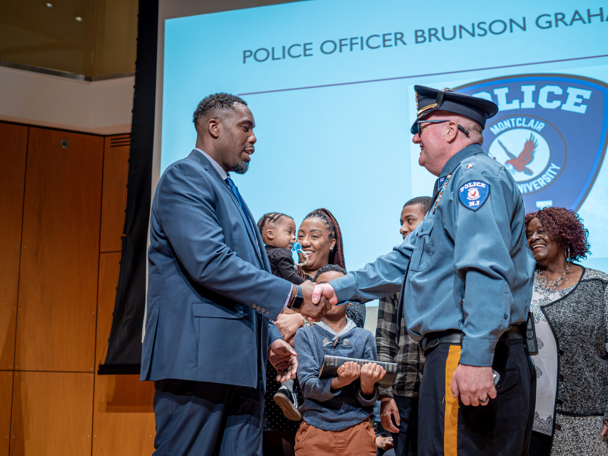 Chief Barrett swearing-in officer Graham. Photo courtesy of Mike Peters