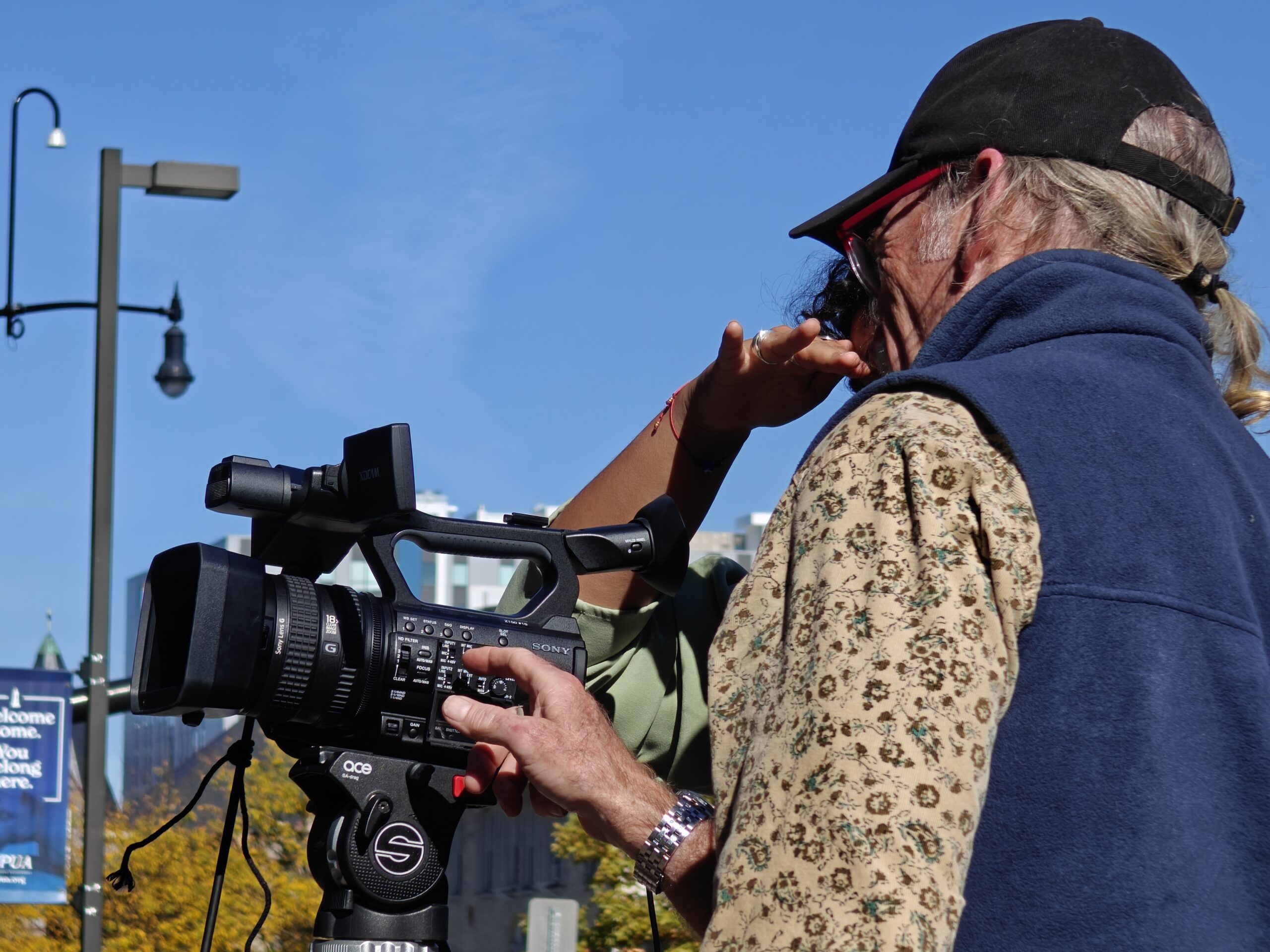 Professor Steve McCarthy helping a student with their video camera. Peter Guziejewski | The Montclarion