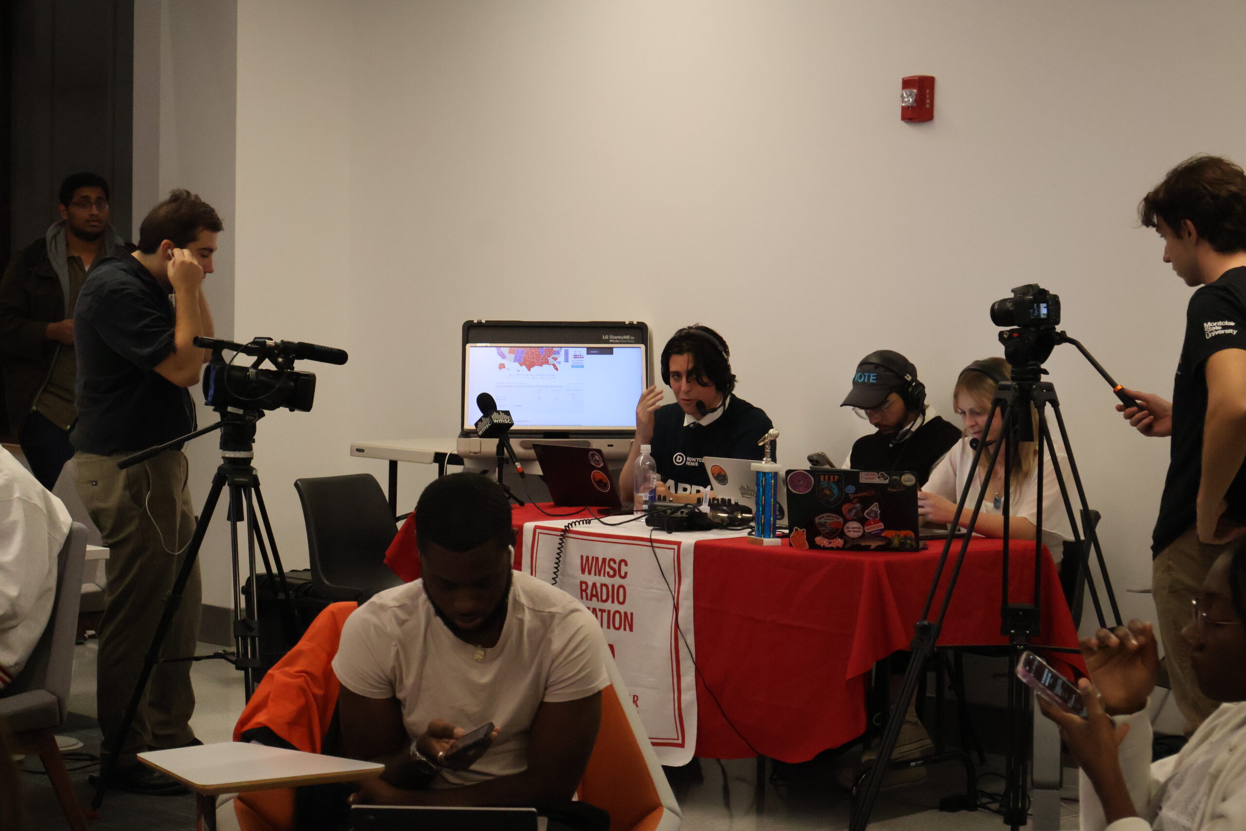 Montclair State University's WMSC records a live radio broadcast reporting on the election results during the watch party.