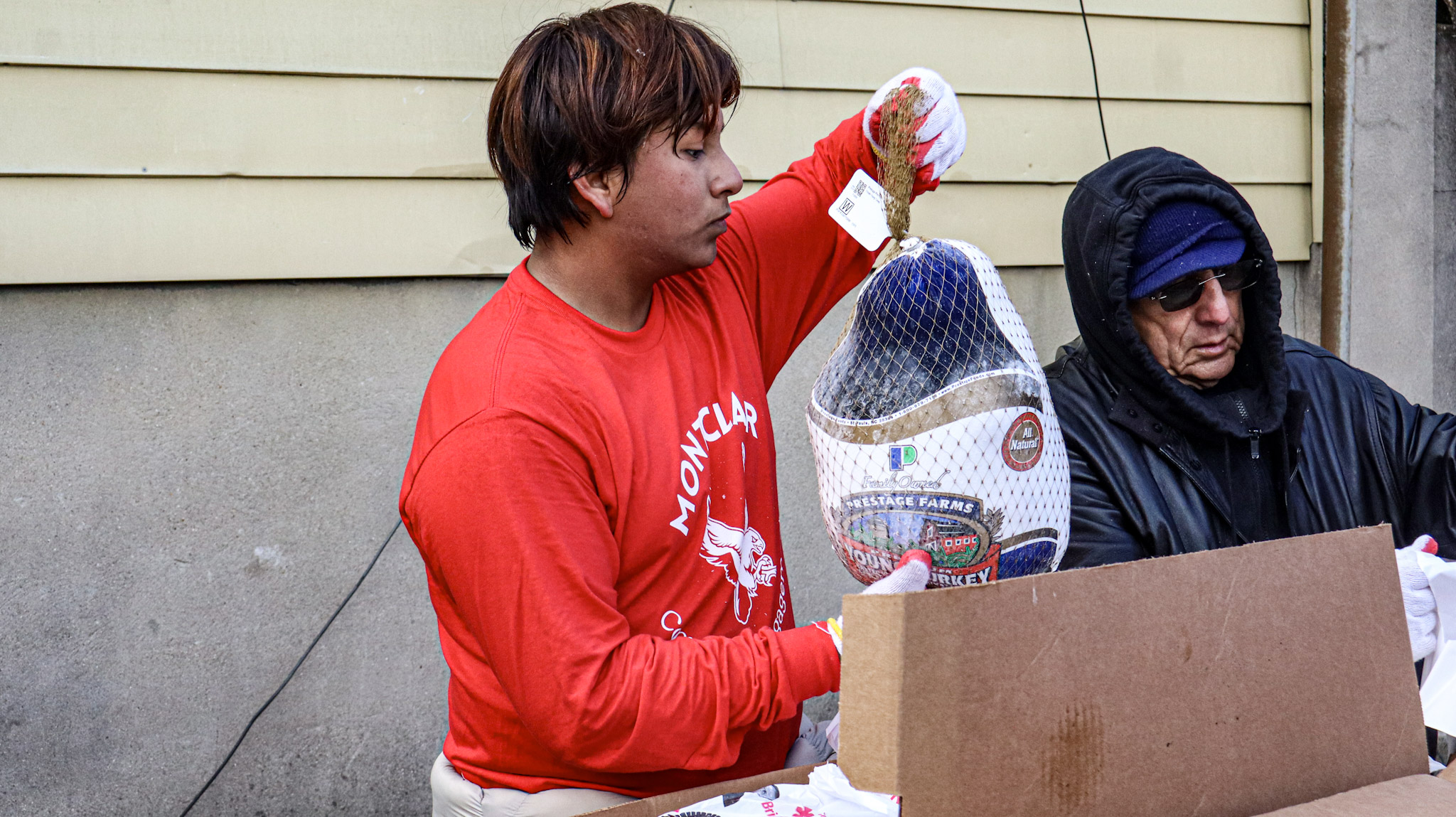 Carlos Revlo participating in the turkey delivery event.