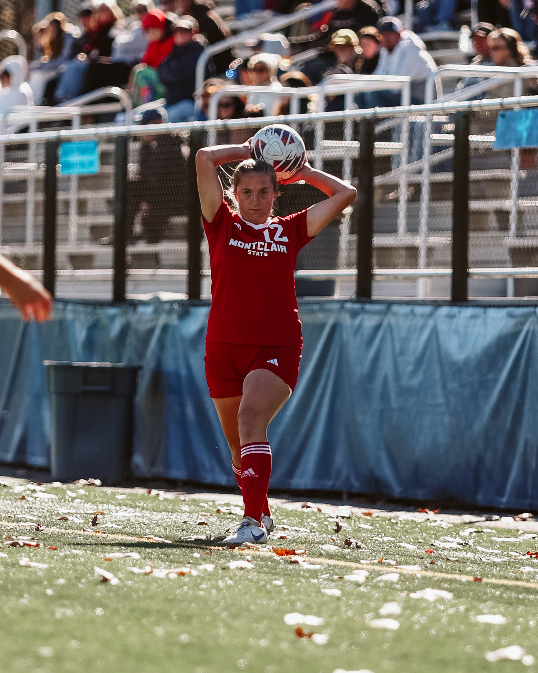 Graduate defender Tara Lambert throws in the ball. | Photo Courtesy of Montclair State Athletics