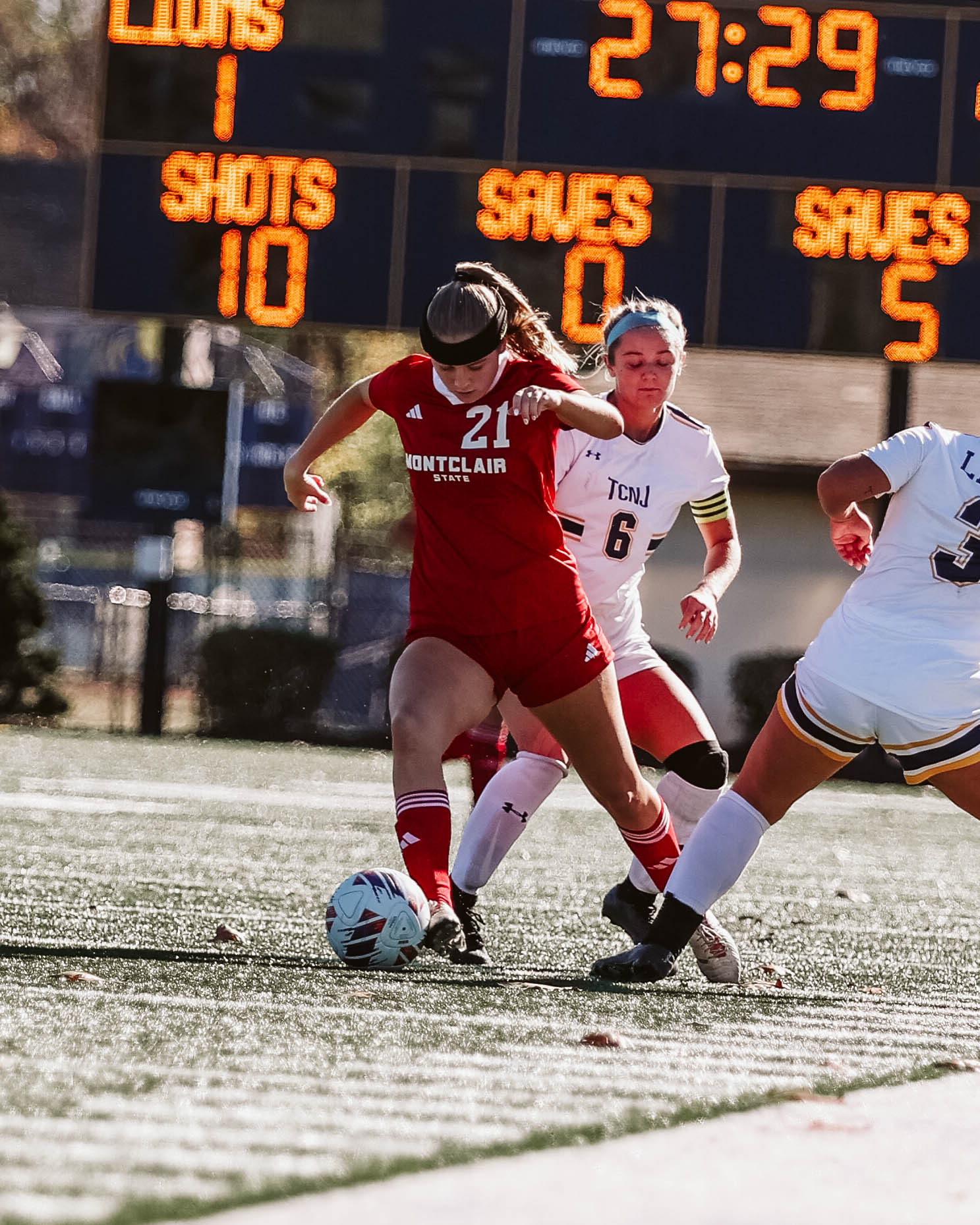 Sophomore forward Madeline Lesica fights for control of the ball.