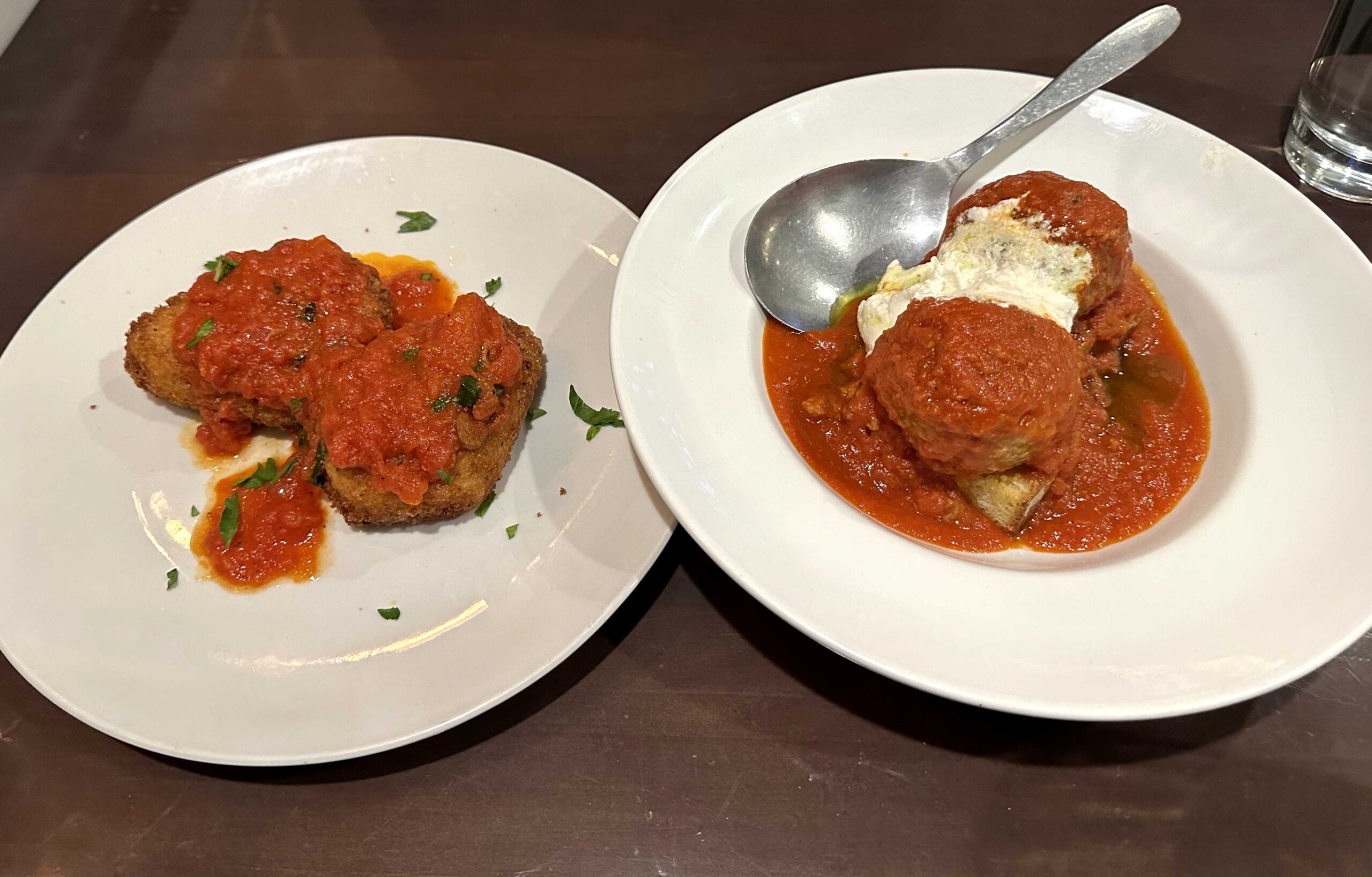 Left: Mozzarella in carozza. Fried mozzarella with basil, tomato, and roasted peppers. Right: Polpette di Nonno, two large meatballs with whipped ricotta cheese in tomato sauce. Jordan Reed | The Montclarion