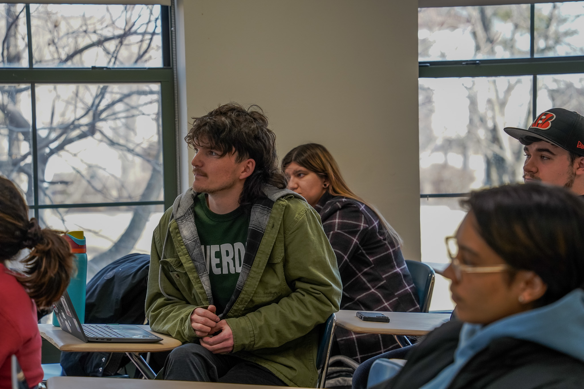 A student watches a discussion at the Political Science Club meeting.
Ava Firmani | The Montclarion