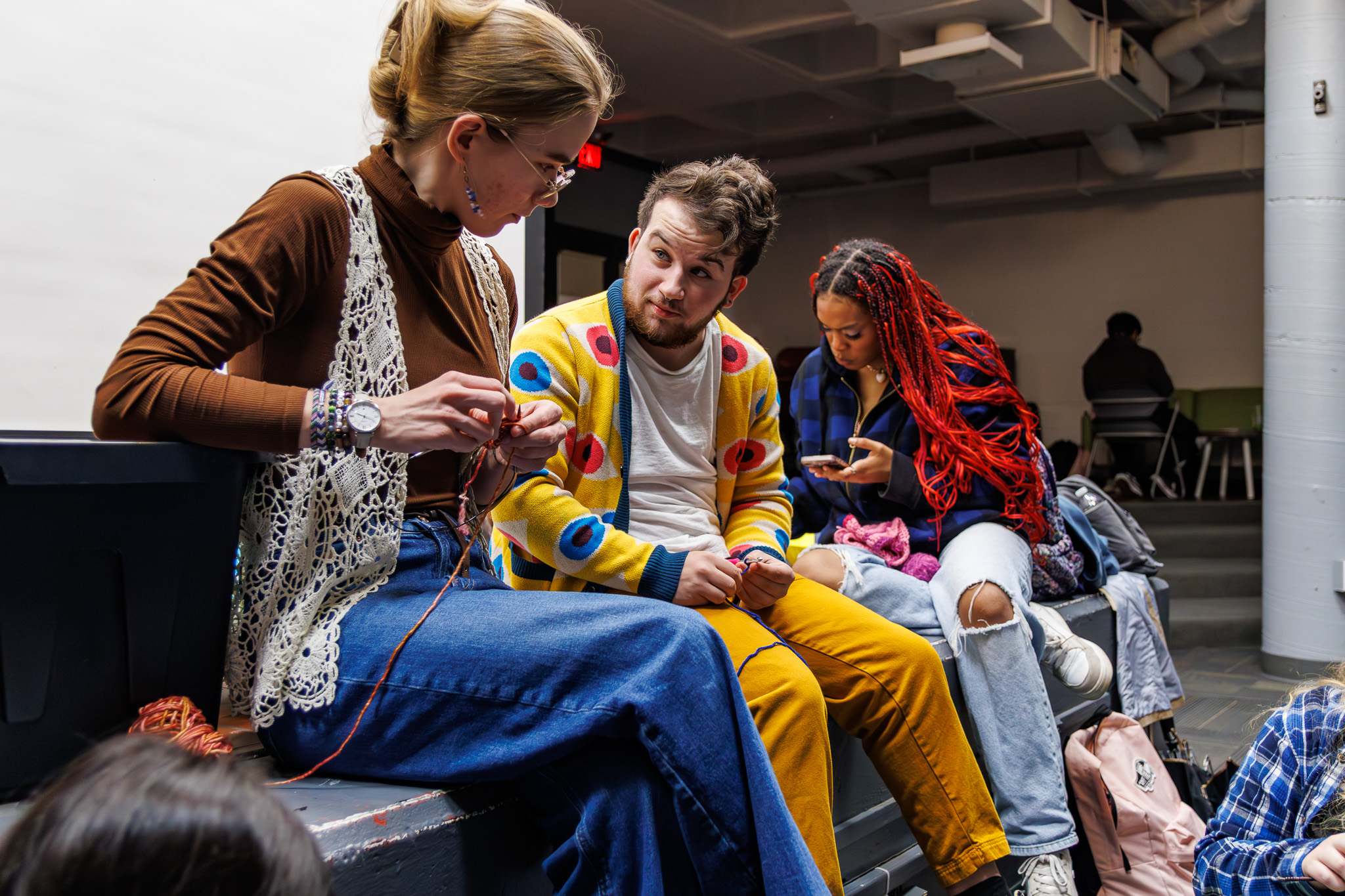 Jamie Yermish (center), a sophomore majoring in jurisprudence, law and society, has been a part of the club since he started at Montclair State. He said that knitting has improved his mental health so much that he is no longer on medication for his anxiety.
Sal DiMaggio | The Montclarion