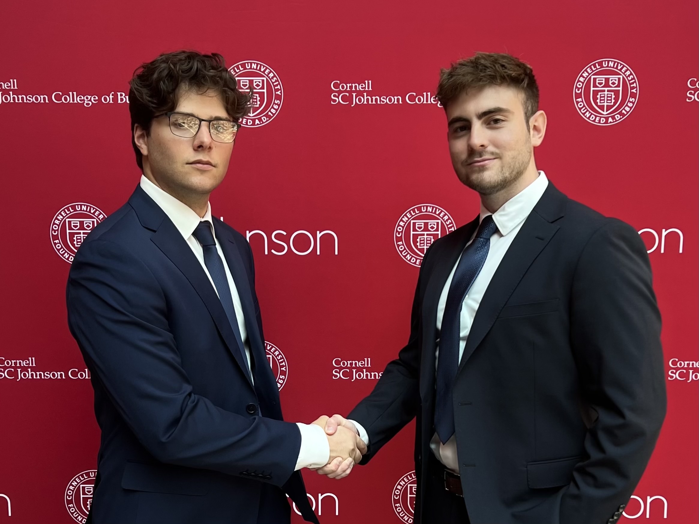 Damian Cacciato (right) and Co-Founder Michael Natenzon (left) proudly accept their feature in the Cornell Business Review.