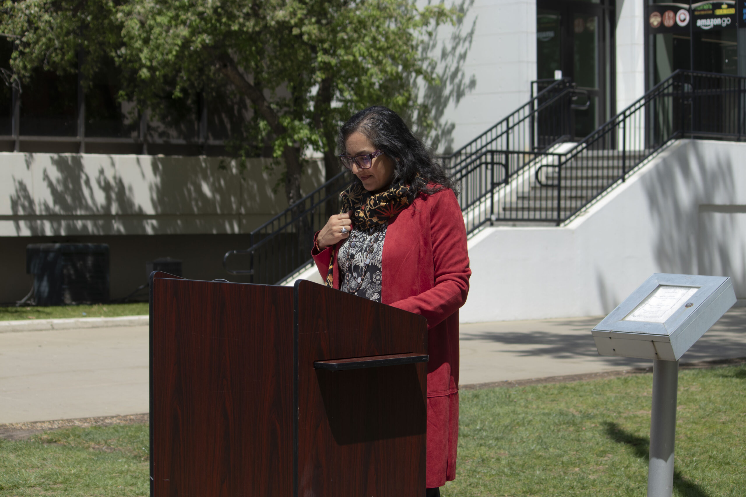 Dr. Wadhwani speaking at Mental Health Awareness Month flag raising ceremony.