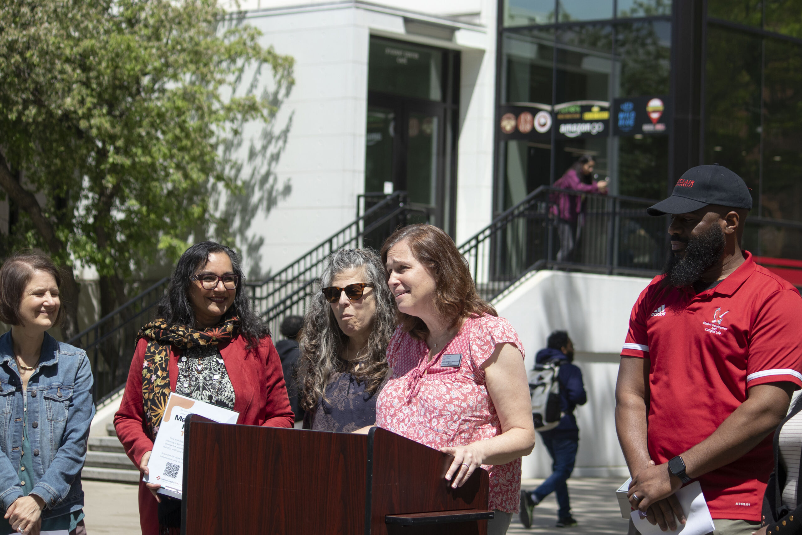 Dr. Jaclyn Friedman-Lombardo speaking at flag raising ceremony.