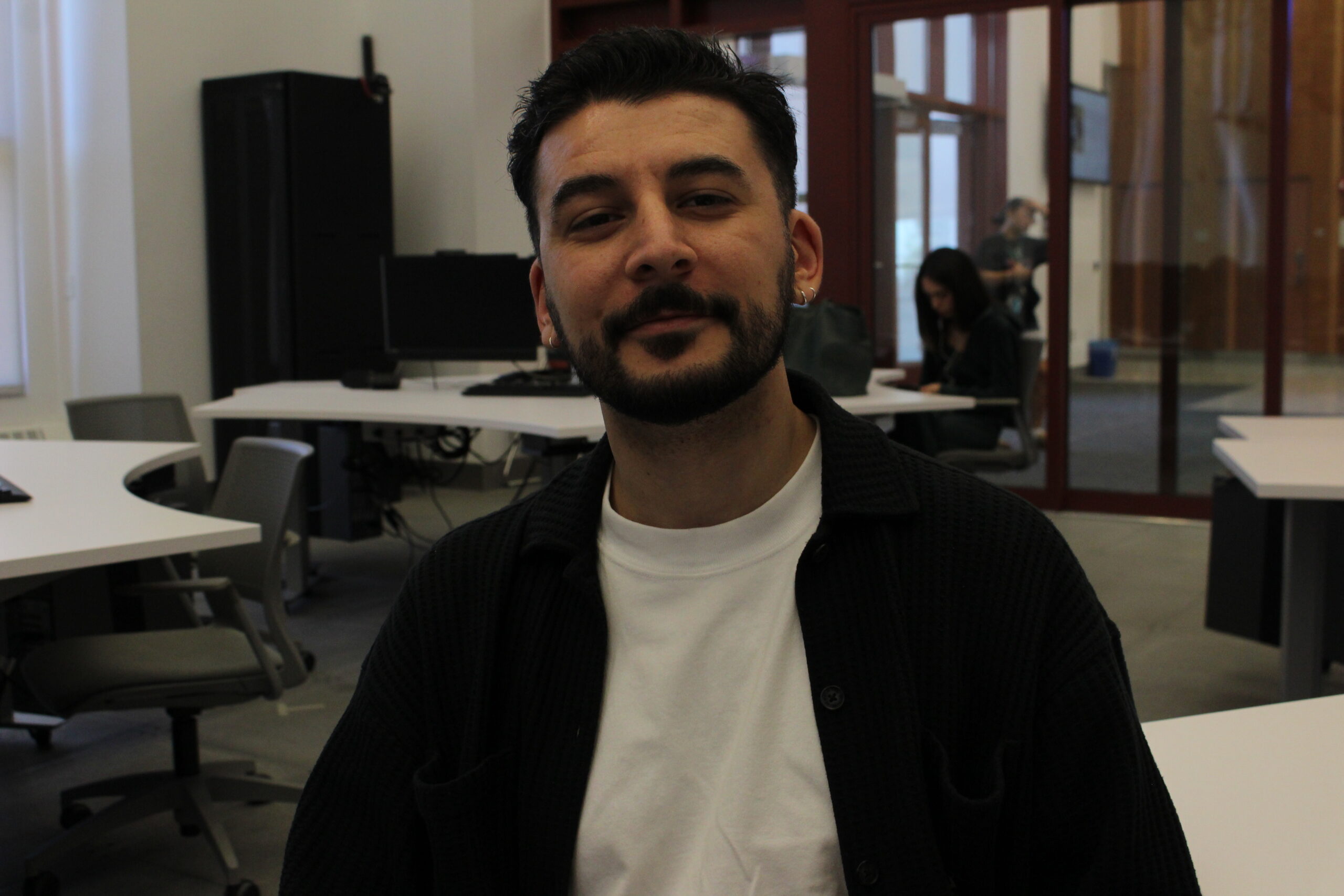 Batuhan Duman, a junior transfer student studying Journalism and Digital Media, gazes at the camera